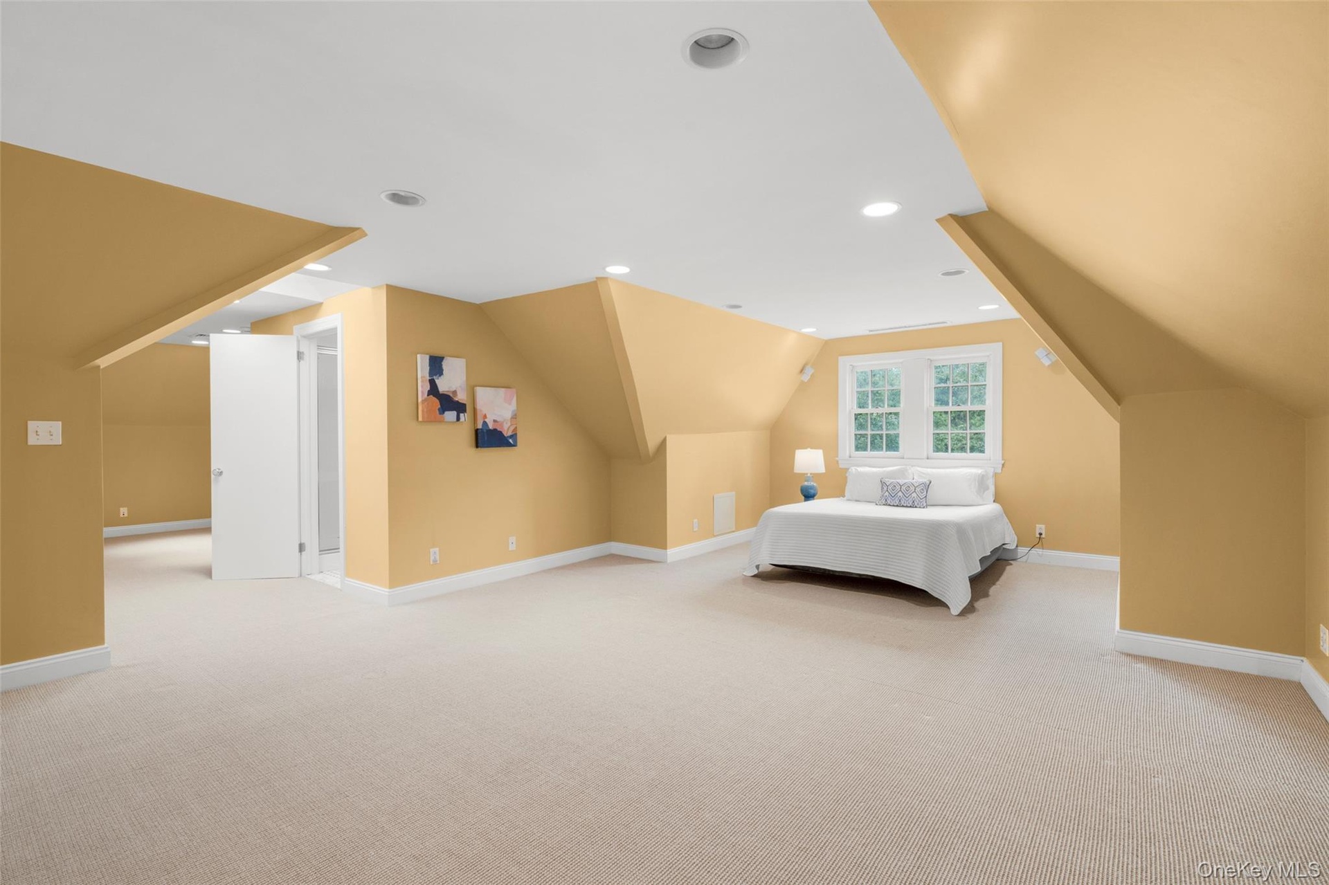 The third-level recreation room is currently being used as a bedroom.