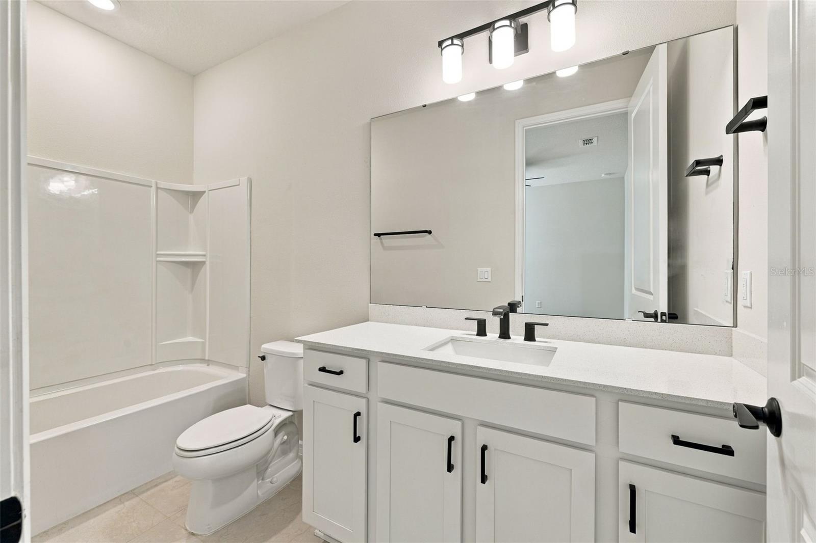 Downstairs Bathroom #3 This Bathroom is inside Room #5 by the Laundry Room