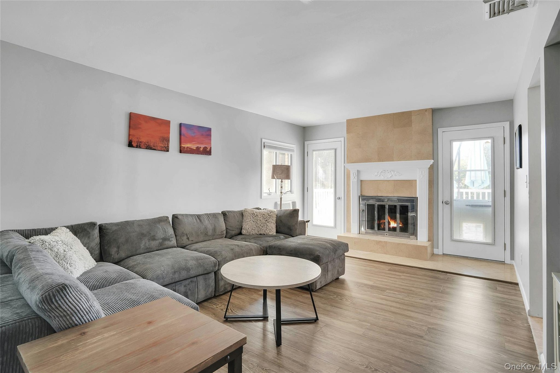 Fireplace has doors to the yard on either side of it.