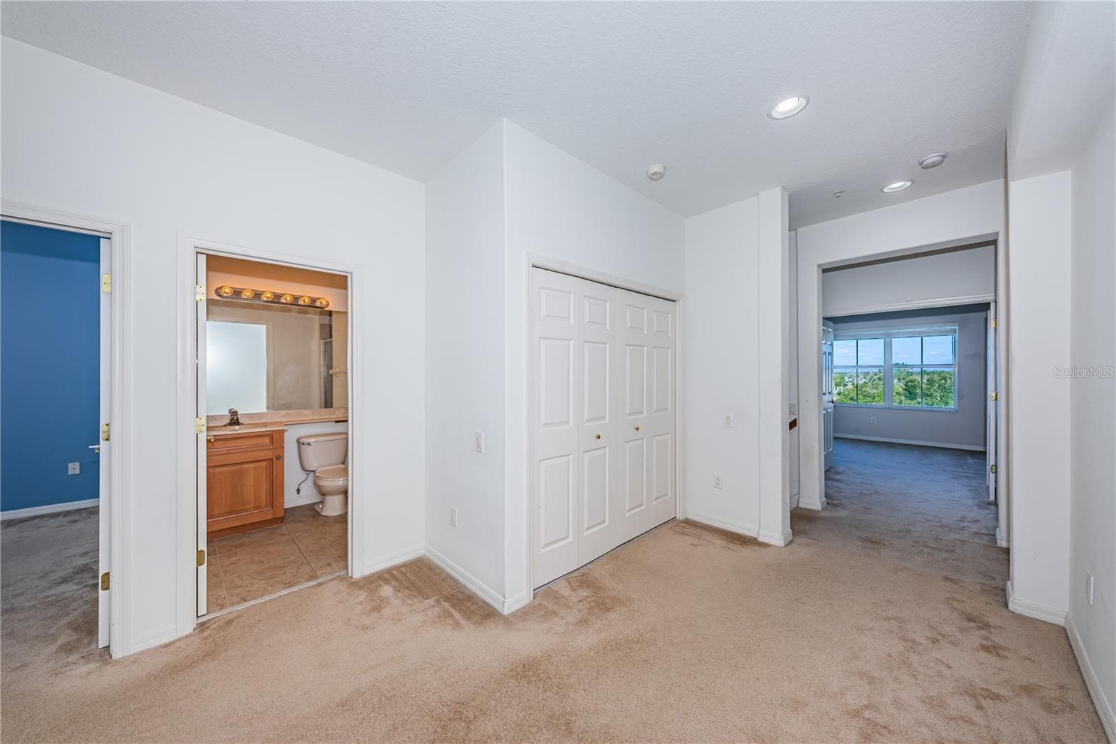 Bedroom level loft with laundry behind center doors