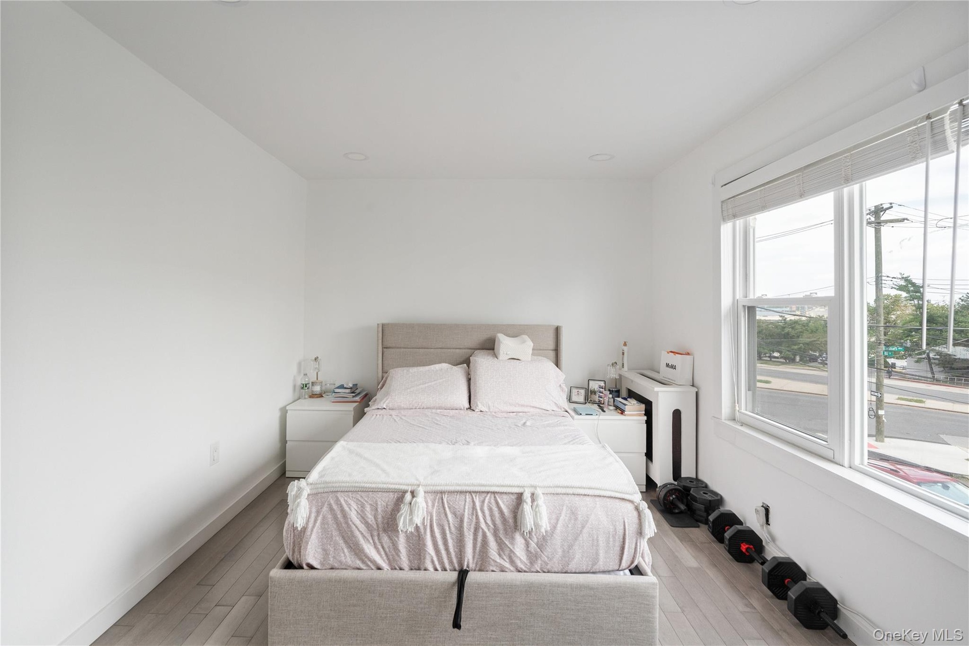 Generously sized bedroom with a clean contemporary design, wide windows, sleek flooring, and plenty of space for additional furnishings. 2nd Floor Uni