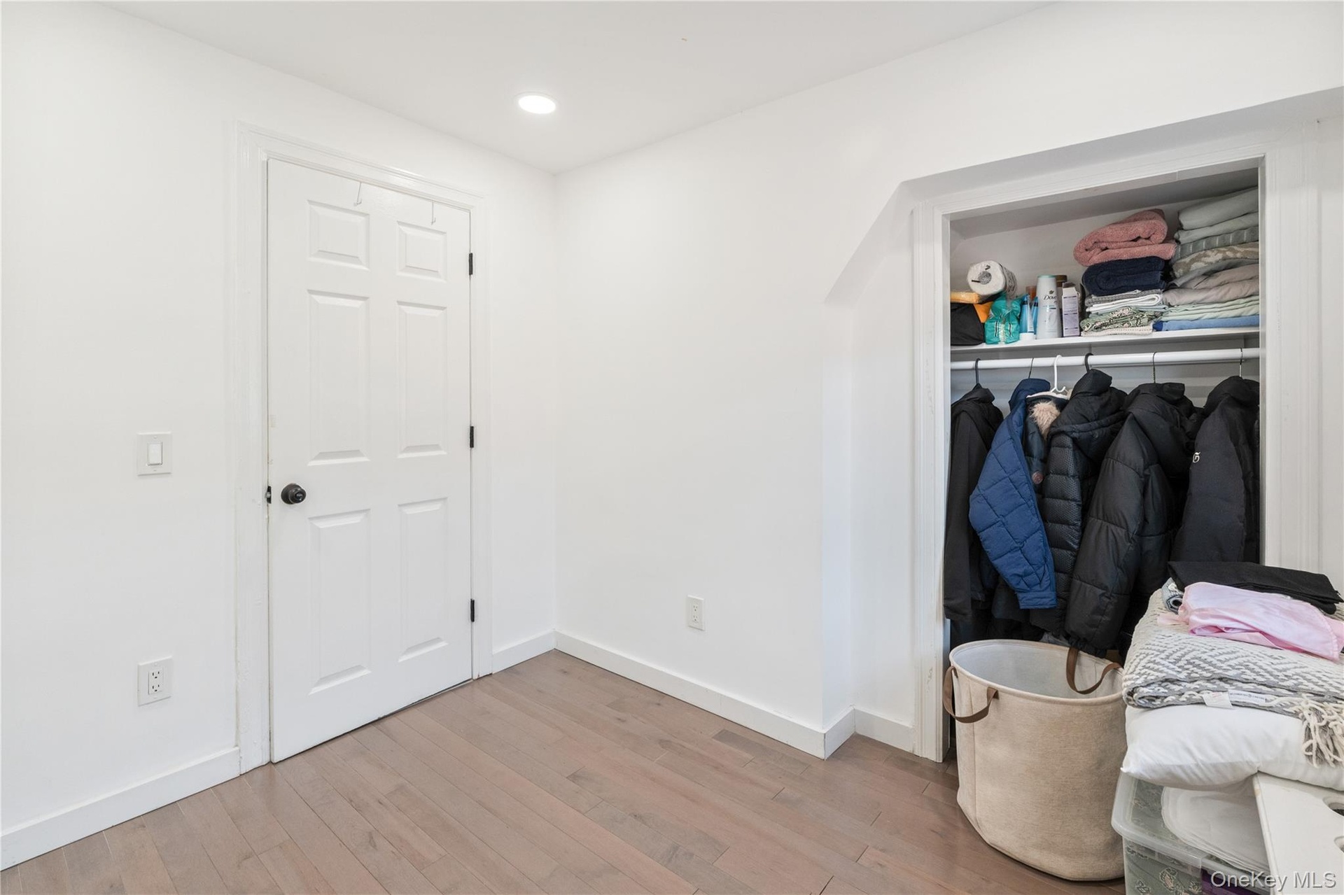 Versatile bonus room featuring modern flooring, recessed lighting, and generous closet space. 2nd Floor. 2nd Floor Unit
