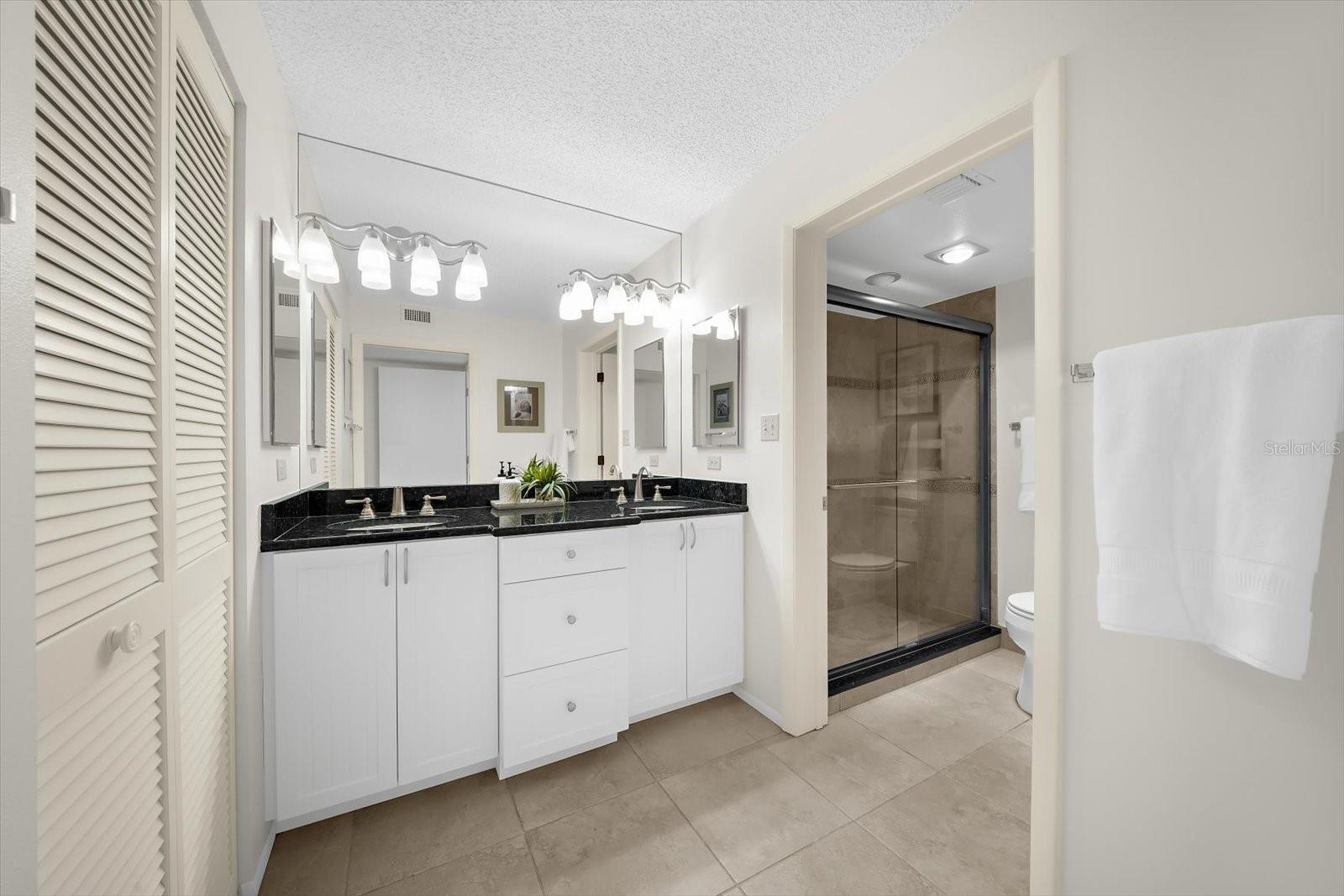 Primary Bathroom with Dual Sinks and Walk-In Shower