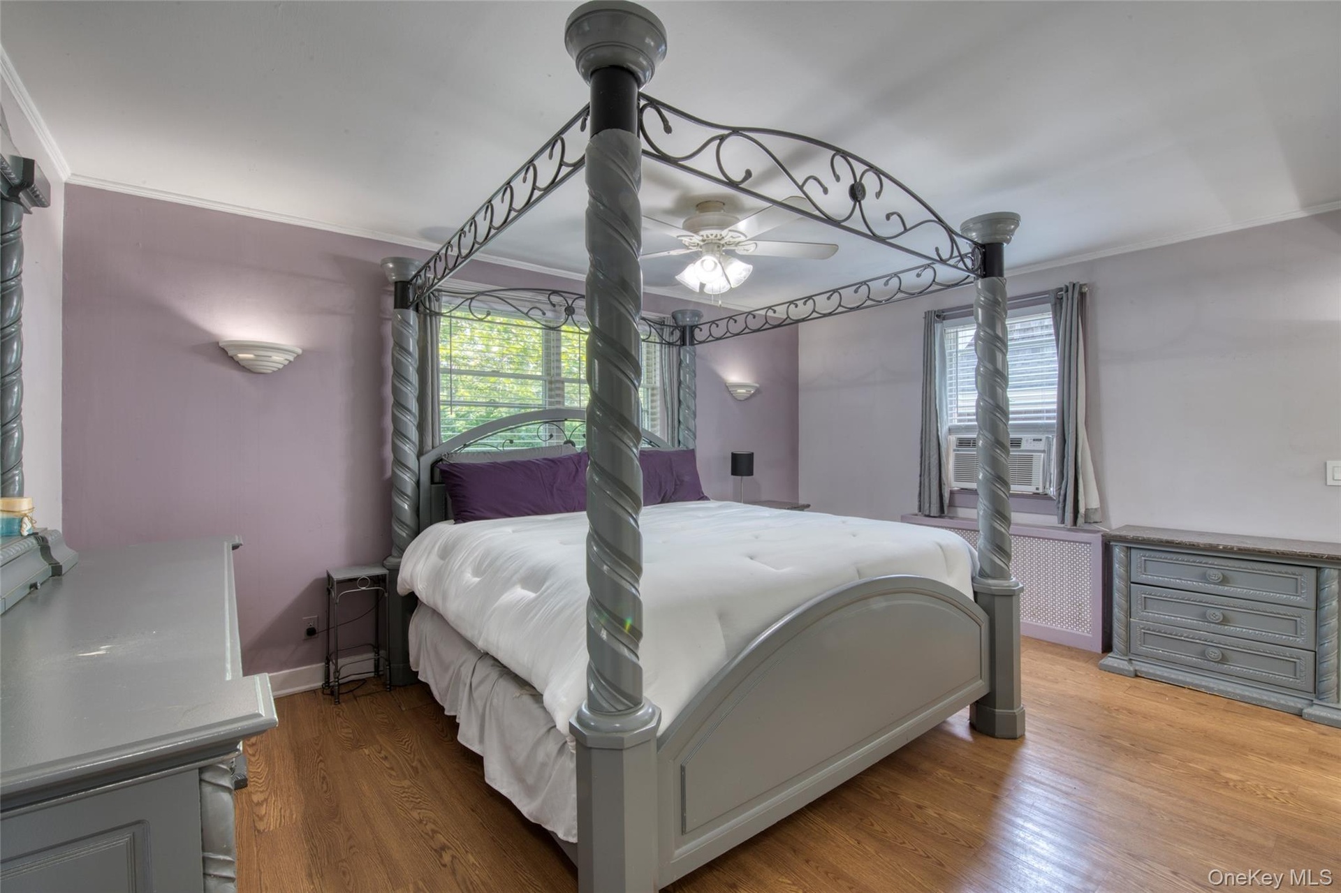 Primary Bedroom with hardwood floors & fireplace