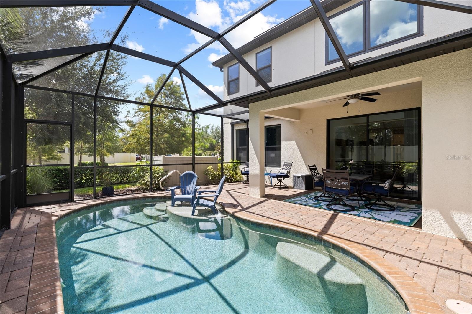 Fully enclosed pool area and covered porch.