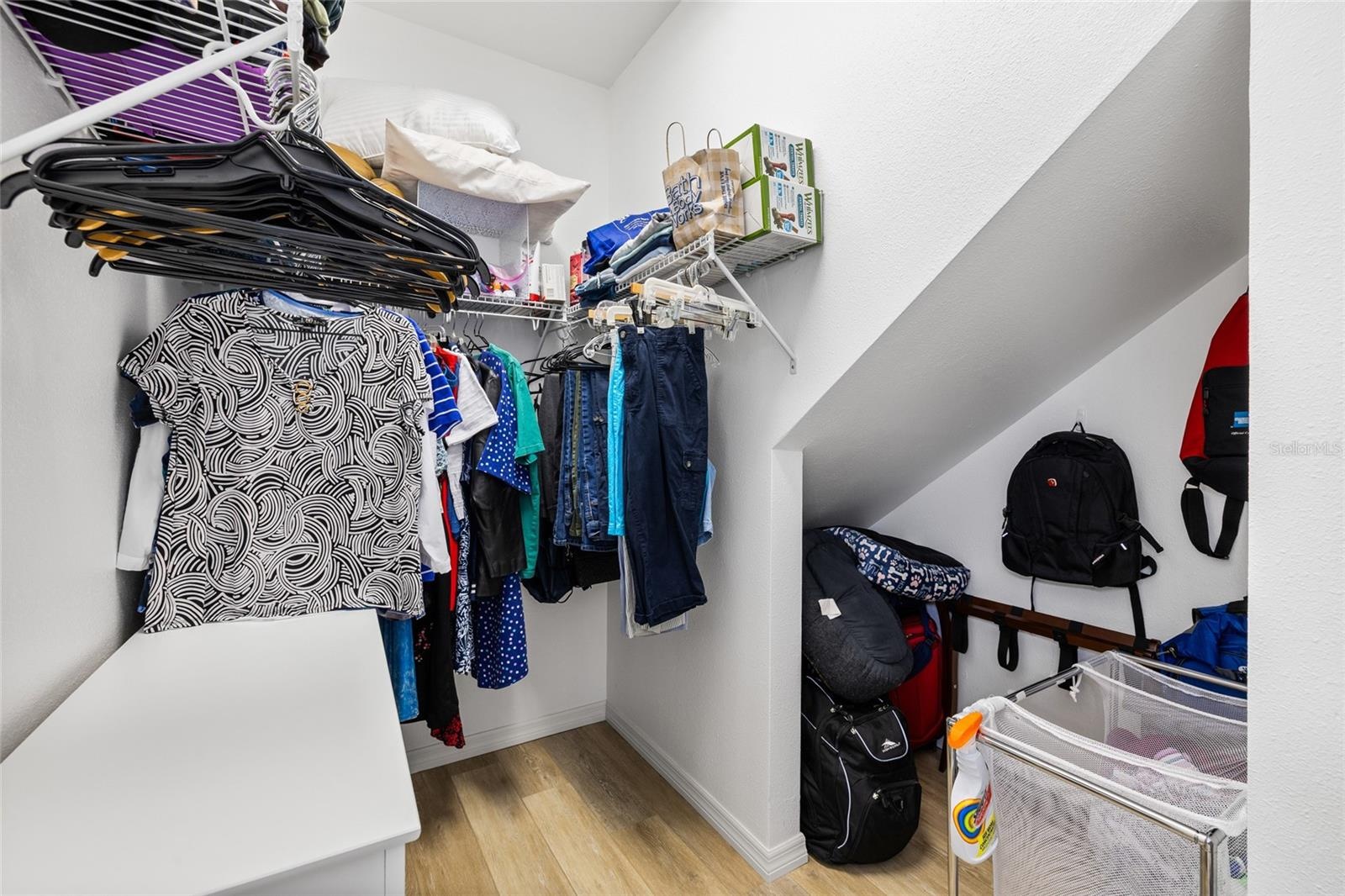 Primary suite walk in closet. Plenty of storage space.
