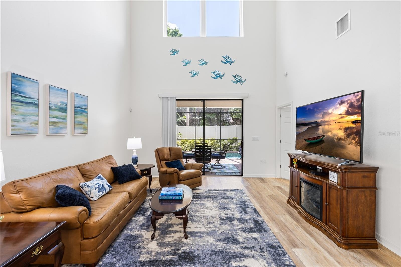 Great room with soaring ceilings, and lots of natural light.
