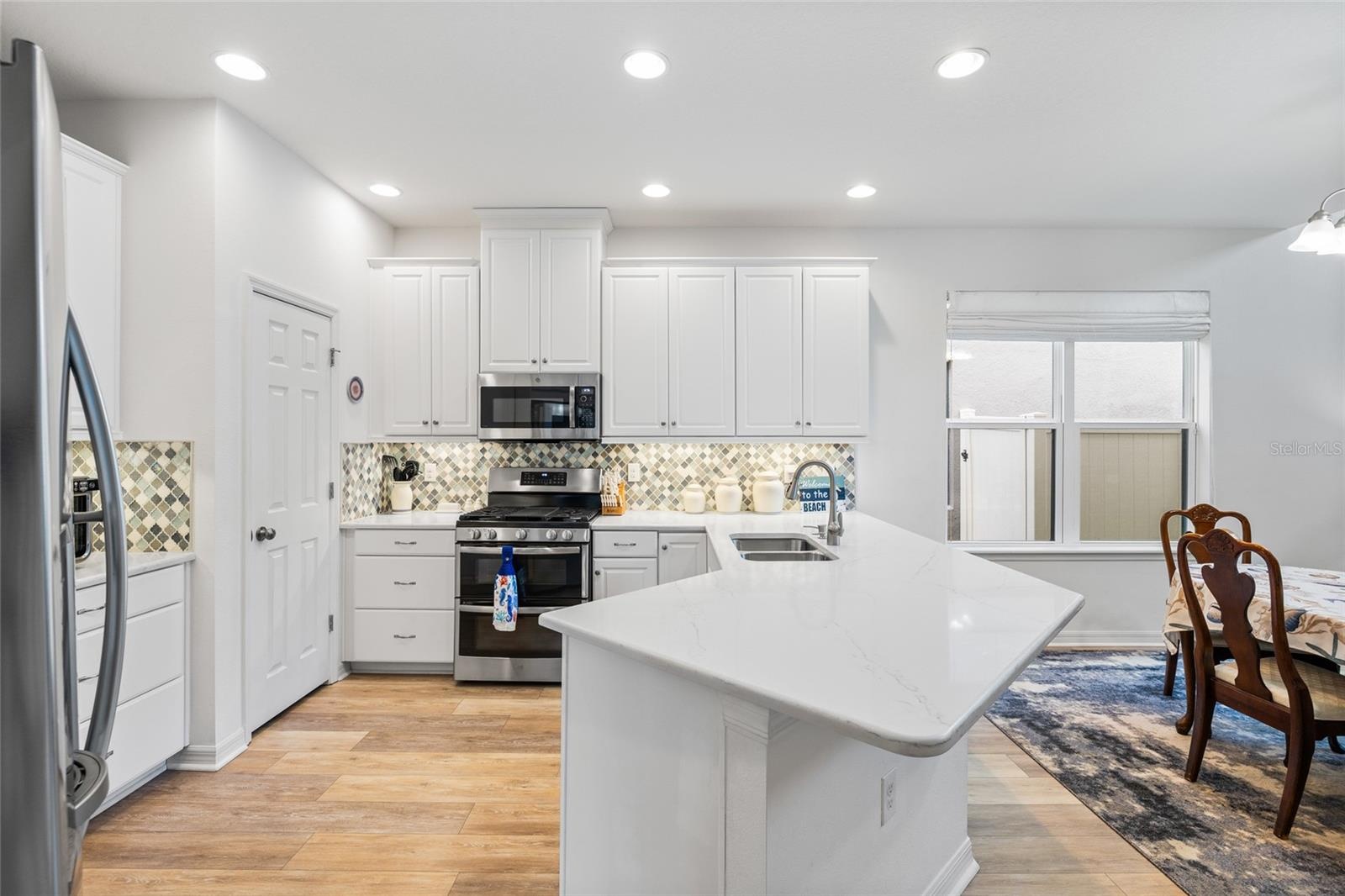 Kitchn area with walk in pantry