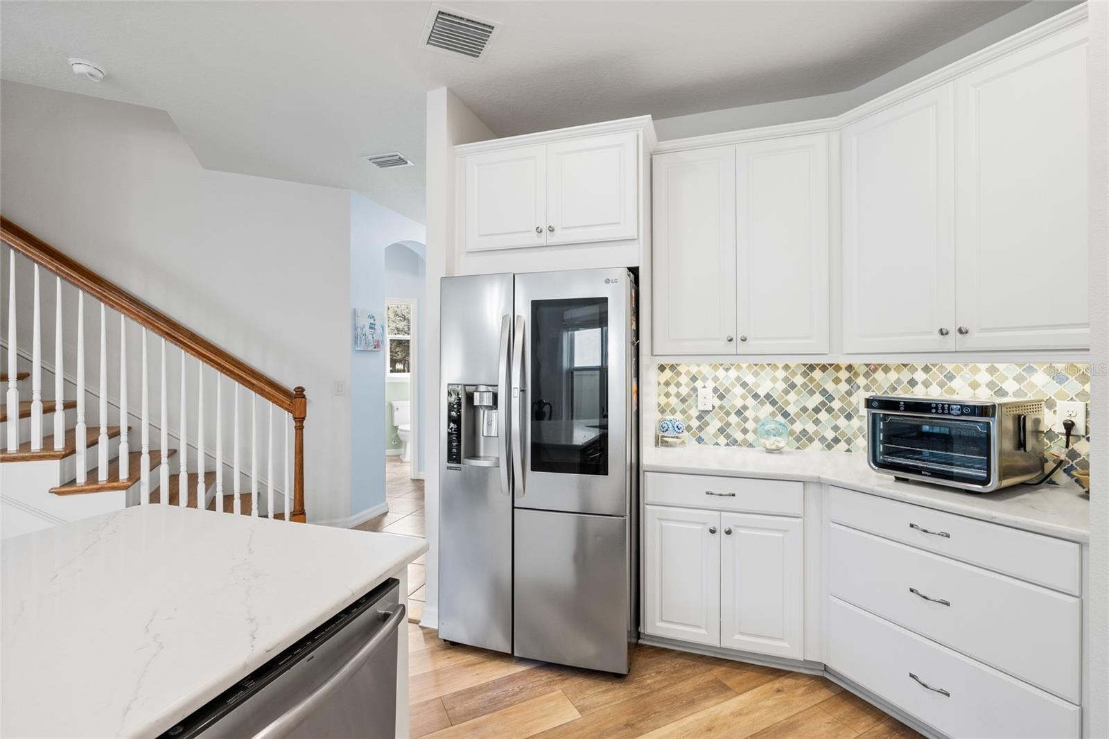 Kitchen looking to entry way.