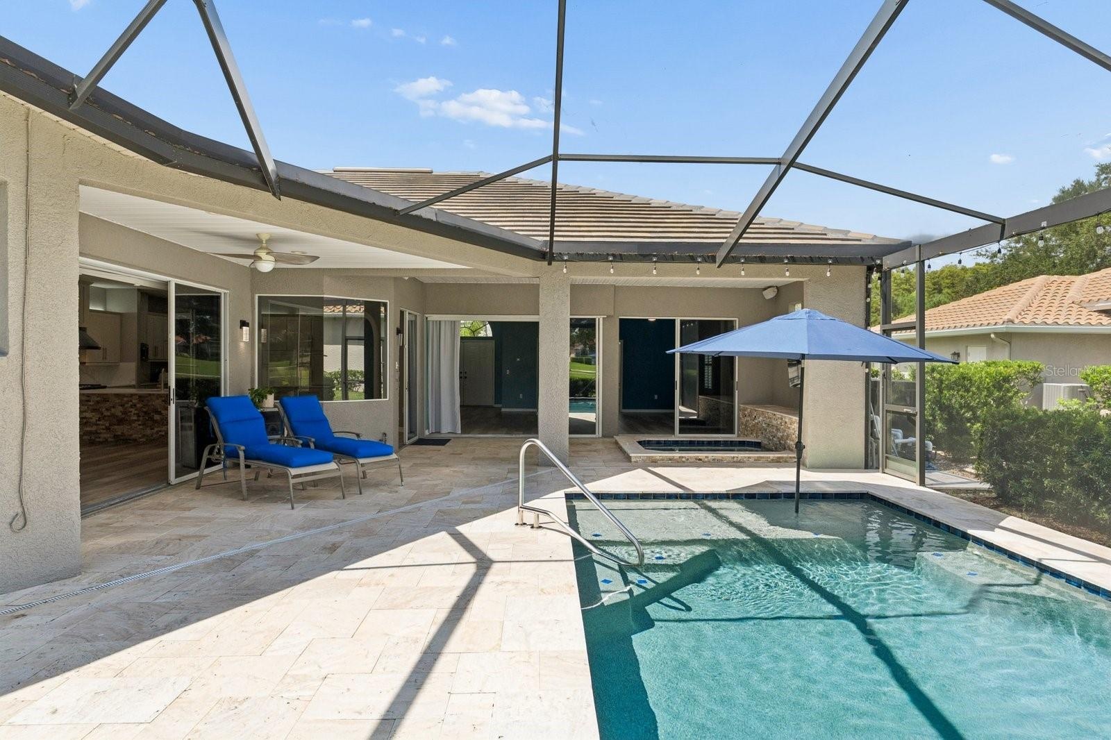 Pool Surrounded by Travertine Decking