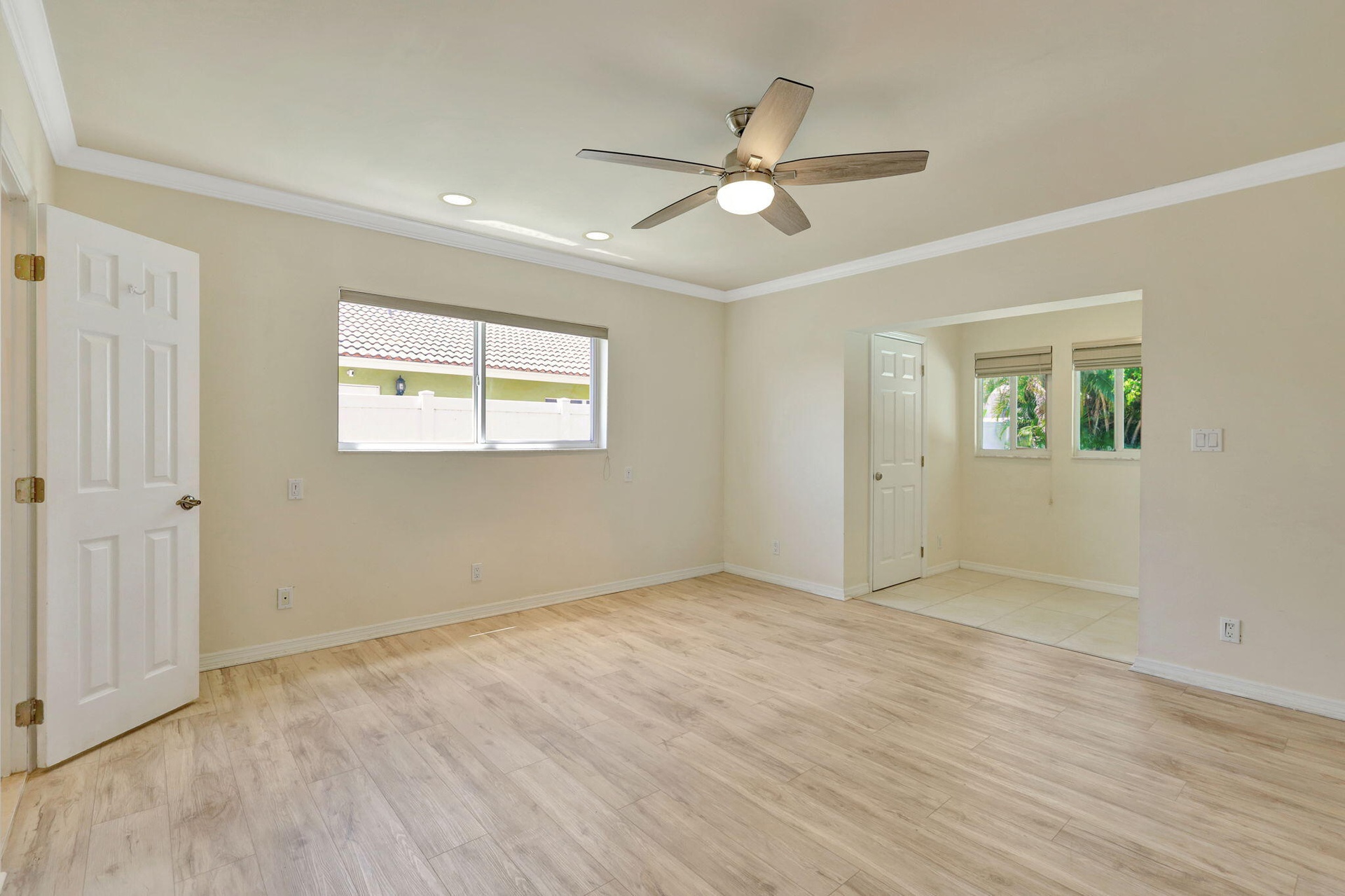 Primary suite with sitting area and access to the patio