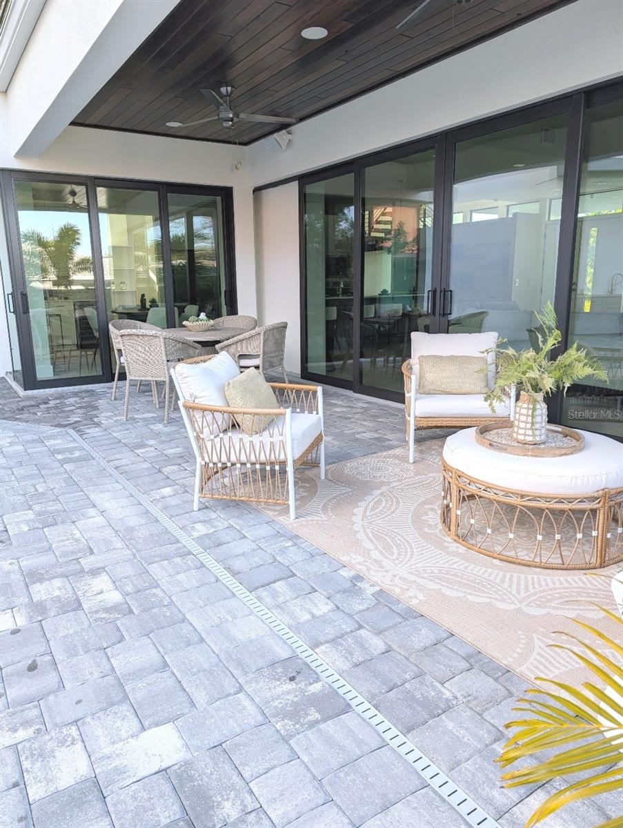 Covered lanai with two fans, music speakers and wifi mesh booster