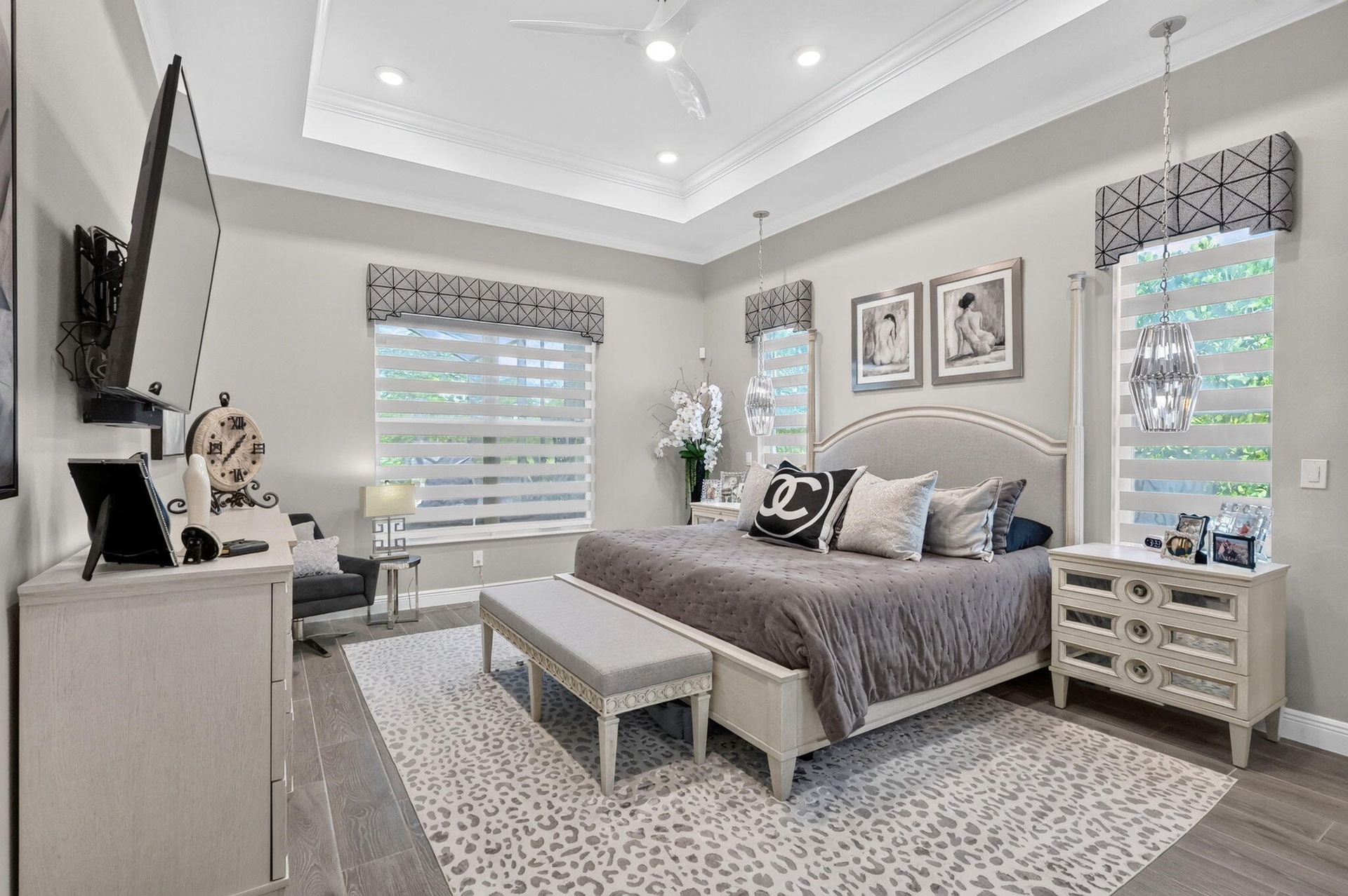Large Primary Bedroom with custom zebra black out blinds automated.