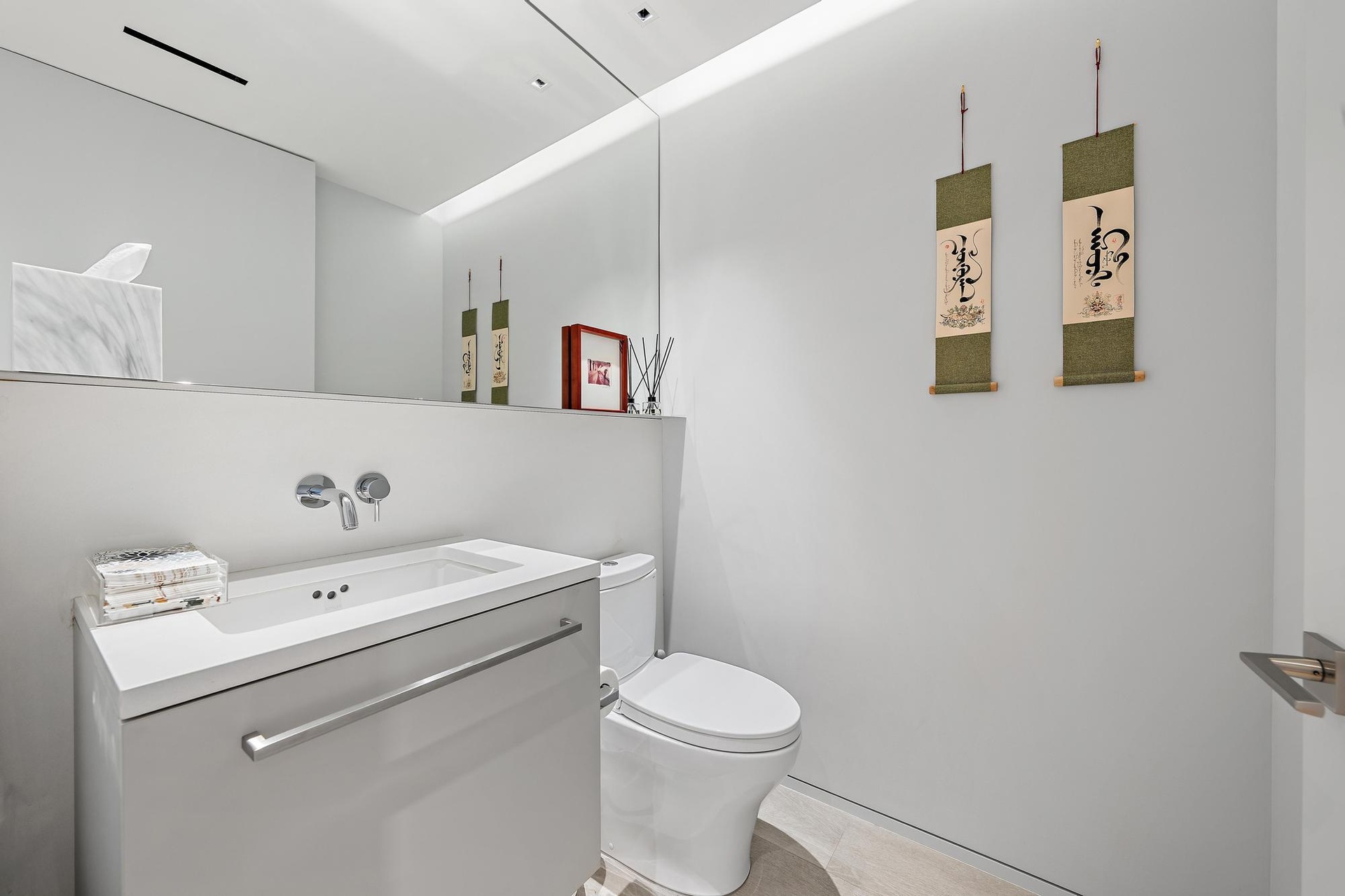 Wall-mounted faucet over an integrated sink and countertop