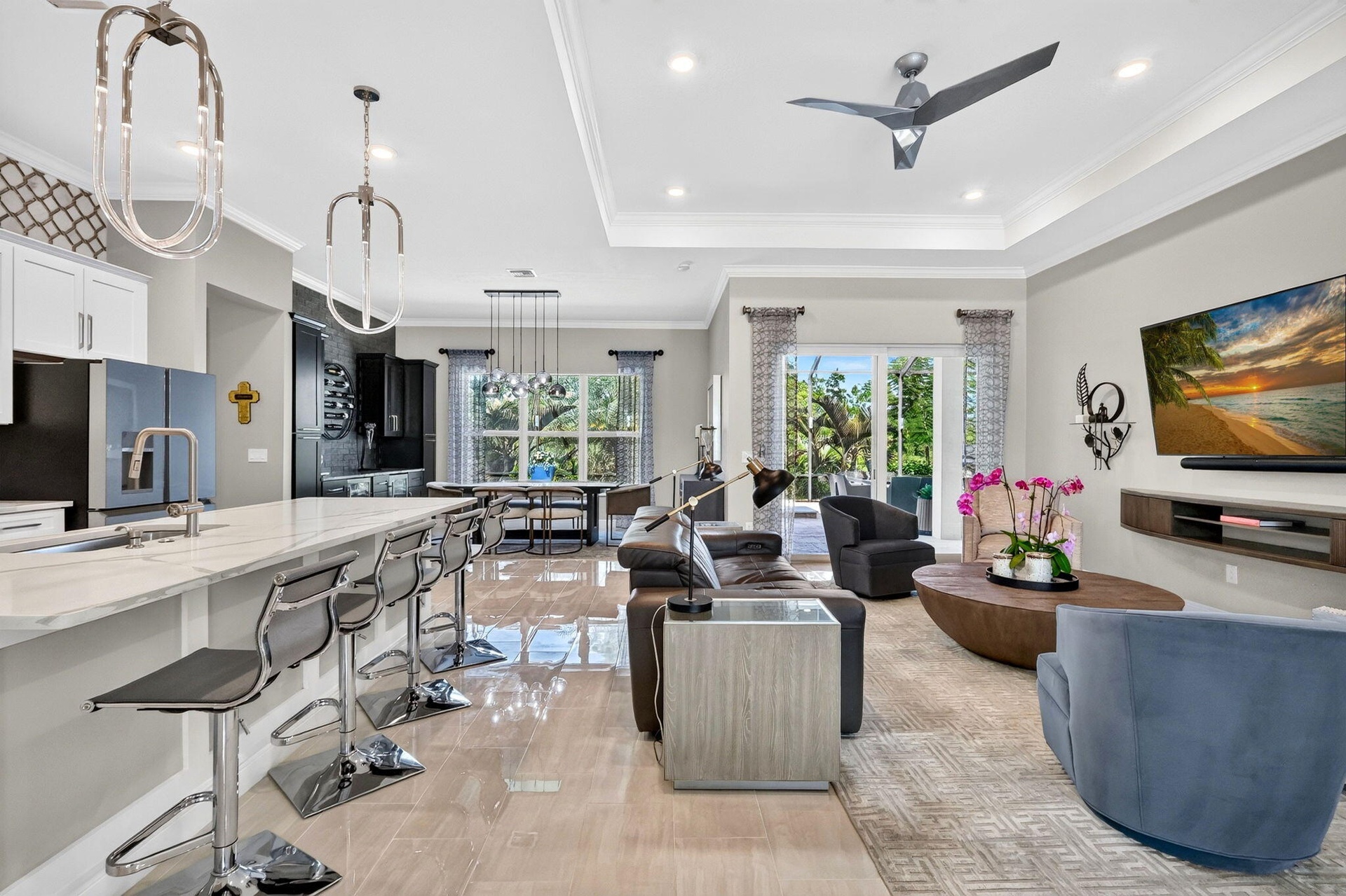 Open Concept Entry/Dining/Living Area with Beautiful view to Pool and outdoor oasis