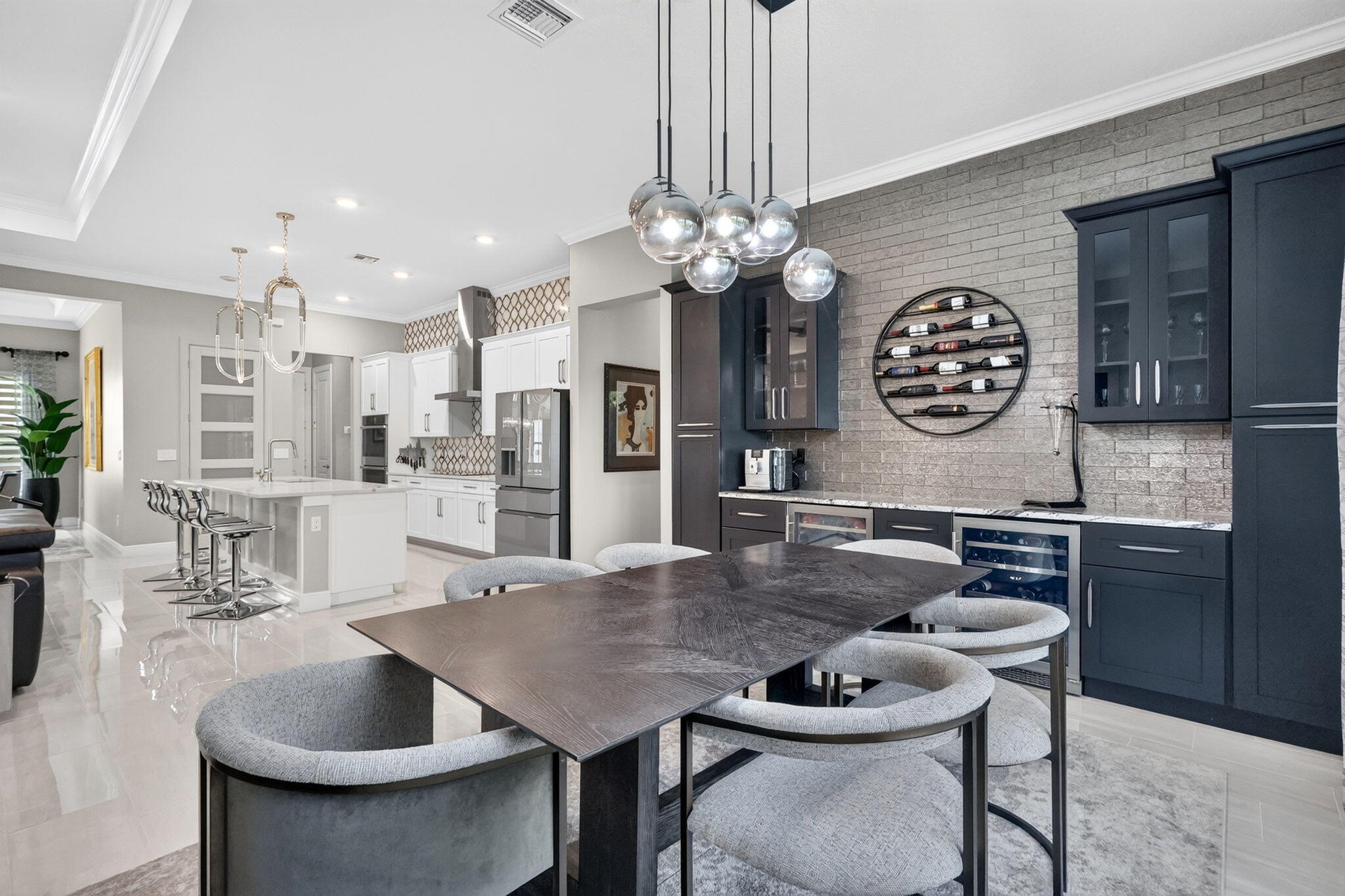 Dining Nook and Custom bar with custom glass tile backsplash and stone counter.