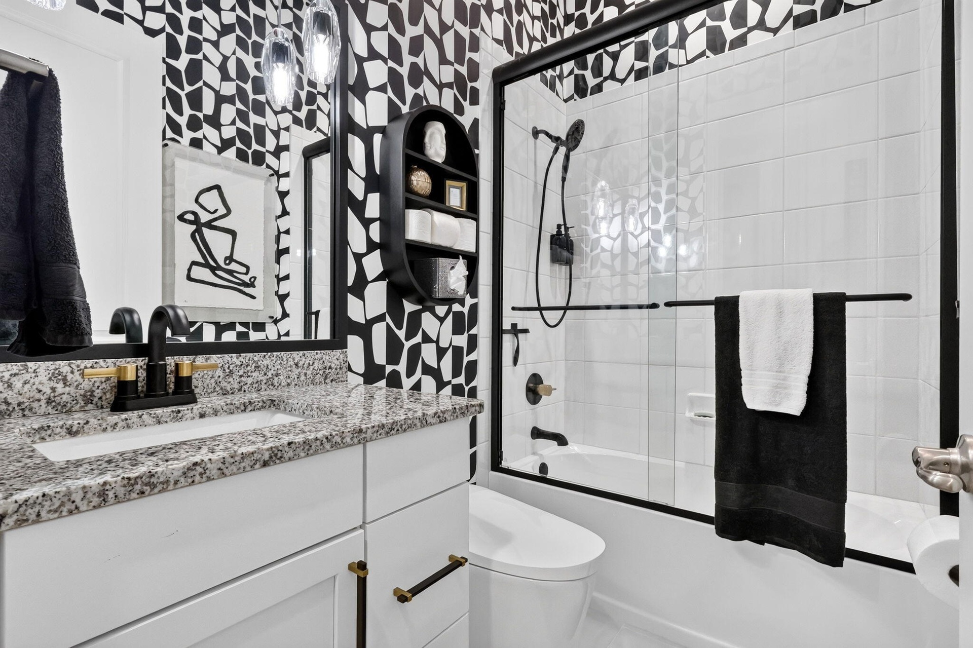 Third Guest Full bath with Bidet toilet, custom wallpaper, pendant lighting, custom glass doors and new fixtures.