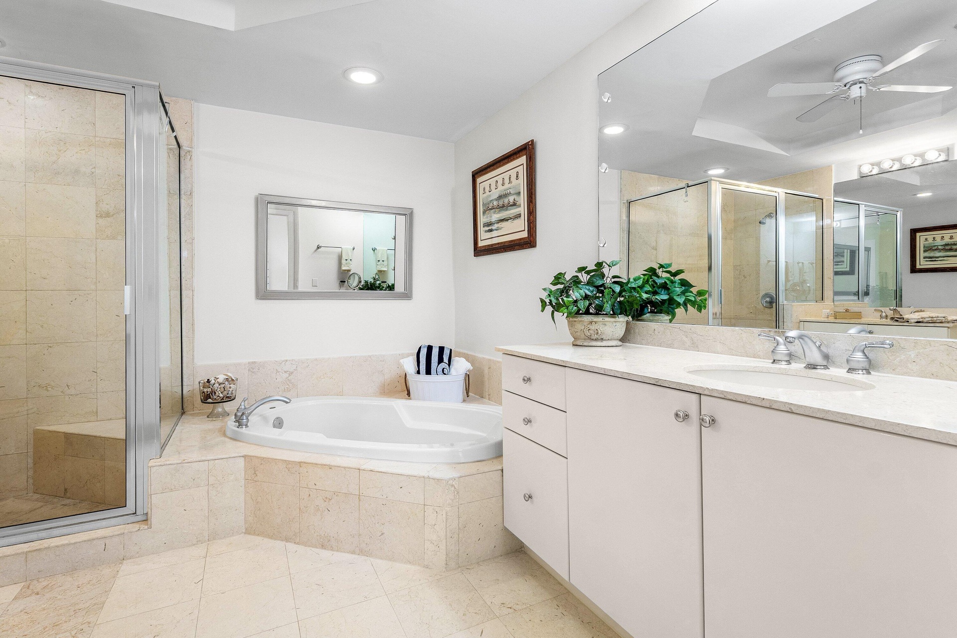 Double Sinks, glass enclosed shower with sitting bench