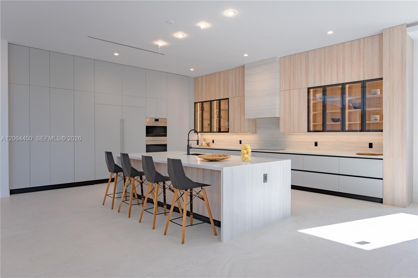Formal dining area with pool views through floor to ceiling glass