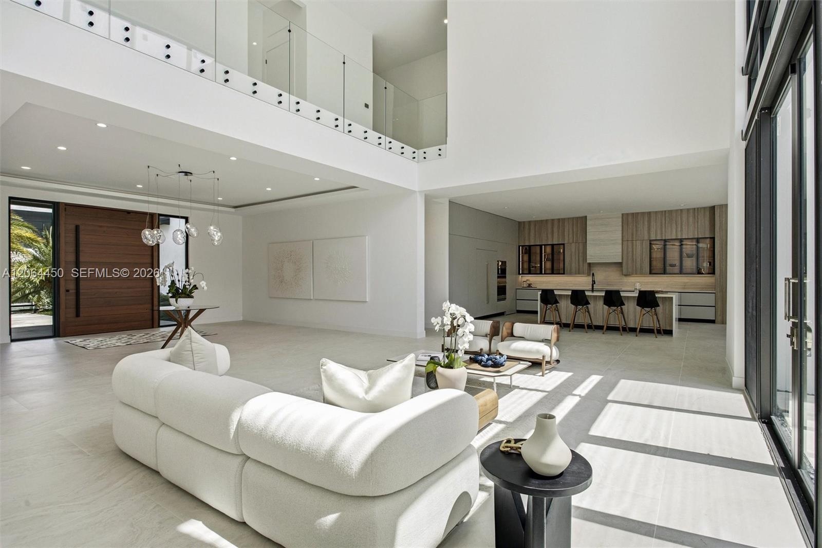 Bright, airy family living space with oversized windows and indoor outdoor connection