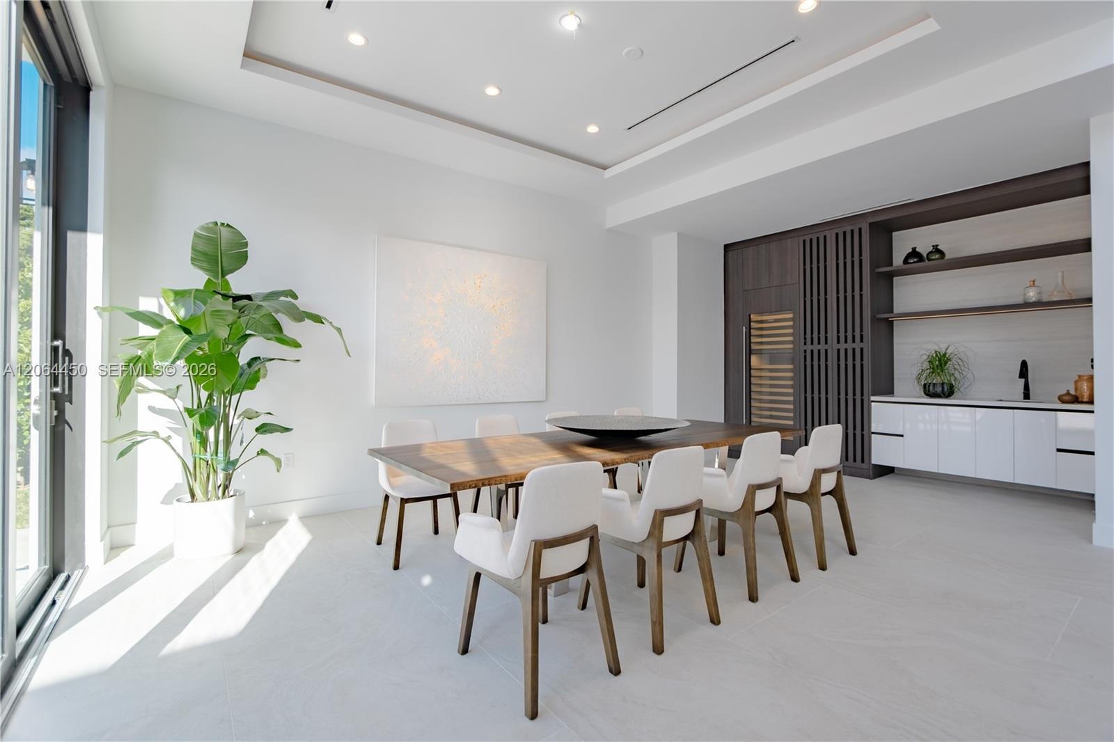 Elevated view of the living area highlighting the scale of the glass walls