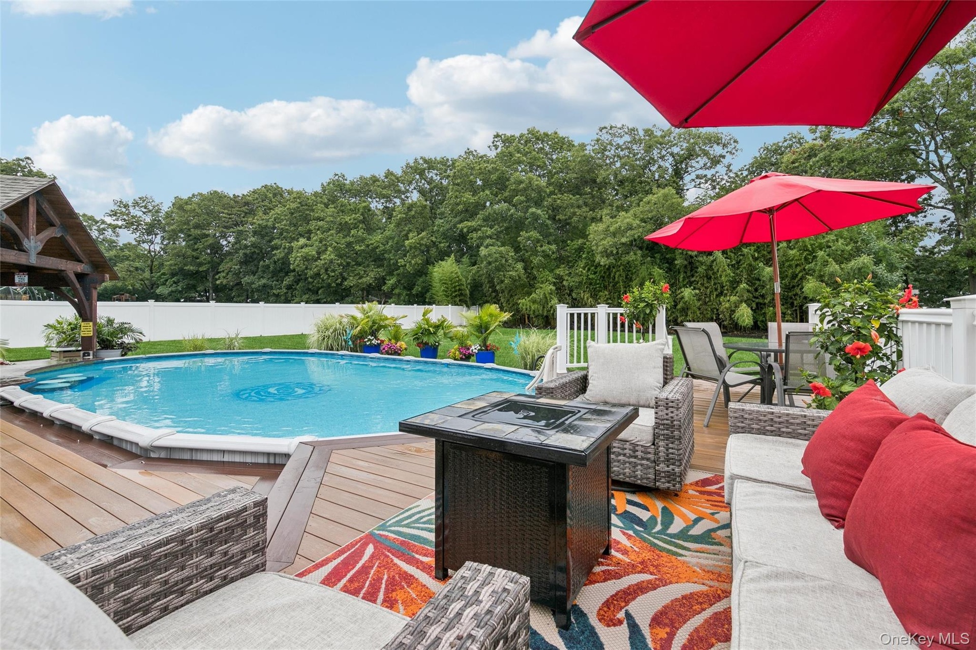 Decking Overlooks Vast Lawn Area with Natural Privacy Behind