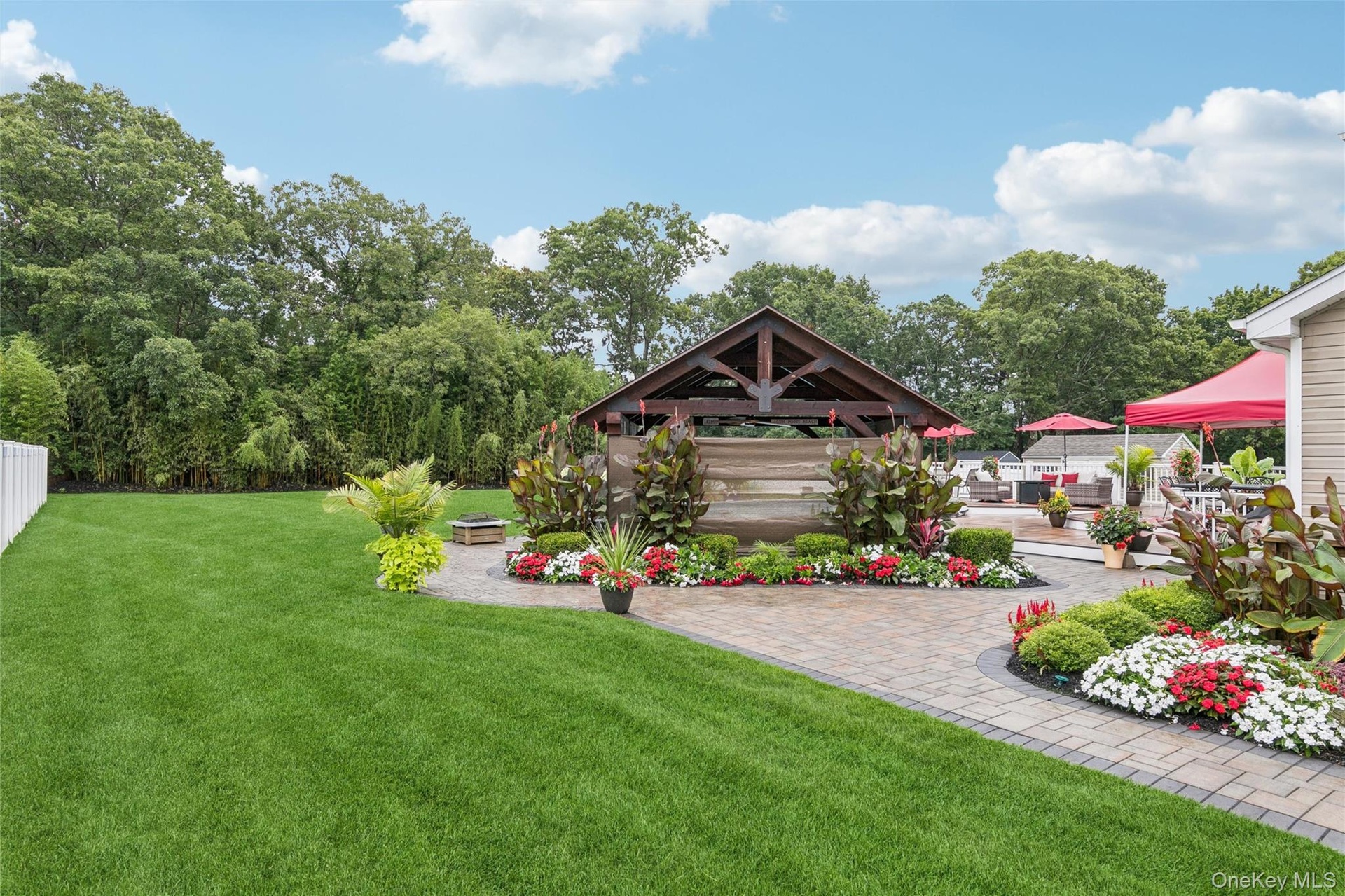 Breath Taking Landscaping Surrounds Ammenity Filled Backyard