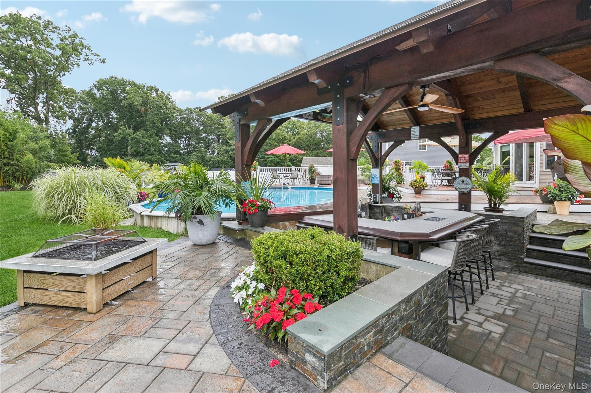 Exquisite Paver and Stone Work Embelish the Sunken Area