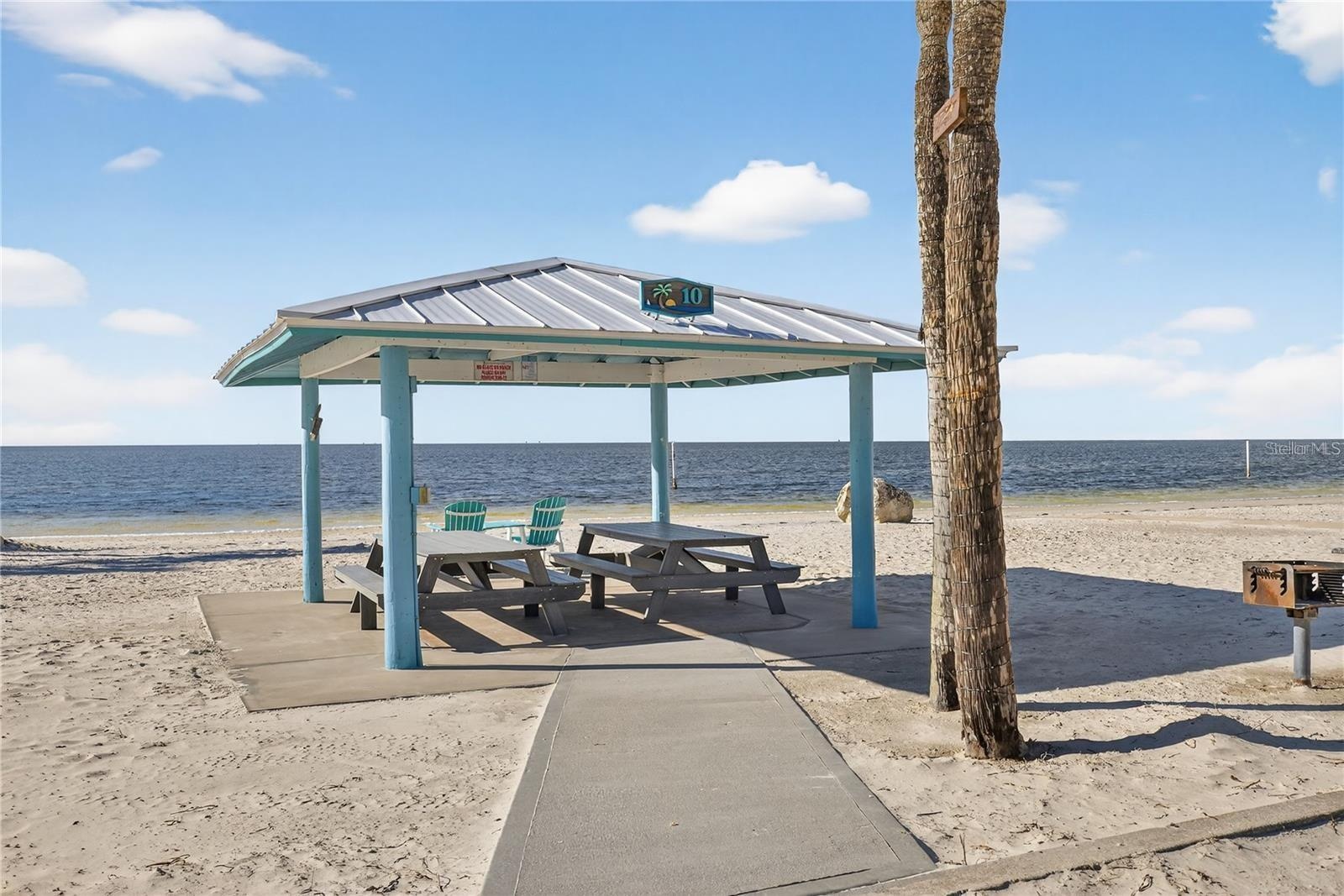 Private beach cabanas and picnic tables