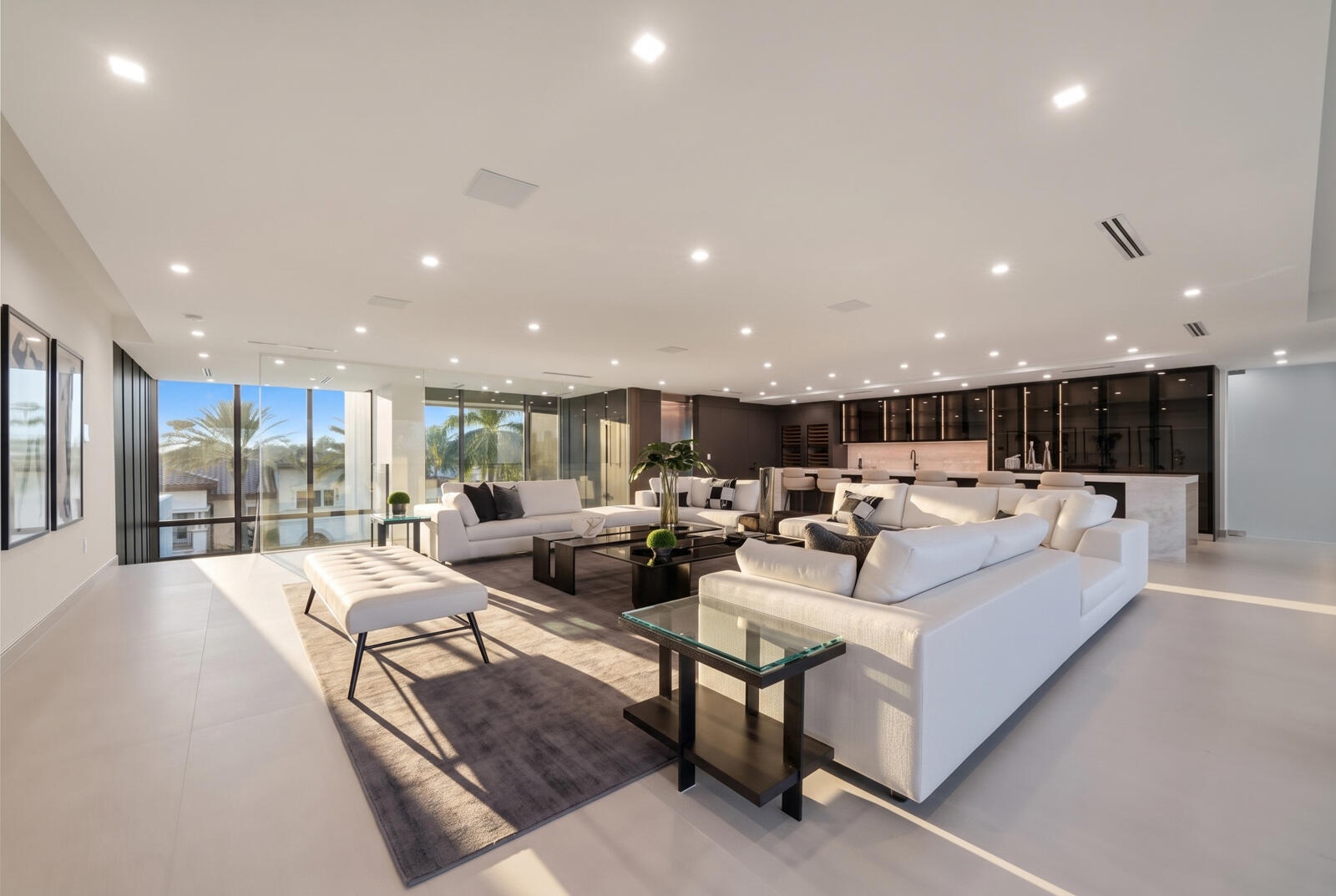 Entire third level conceived as a private entertainment destination, combining an expansive sky lounge, illuminated onyx bar, dual wine storage, and a
