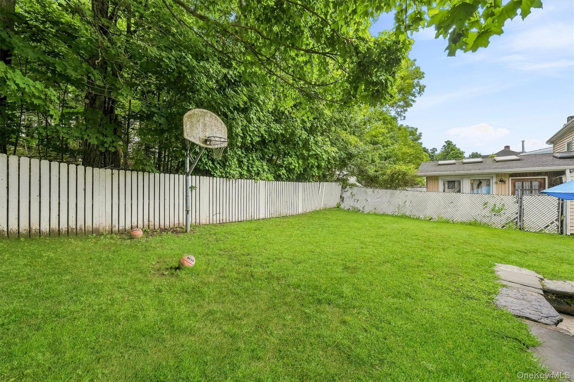 Another yard view showing the open lawn.