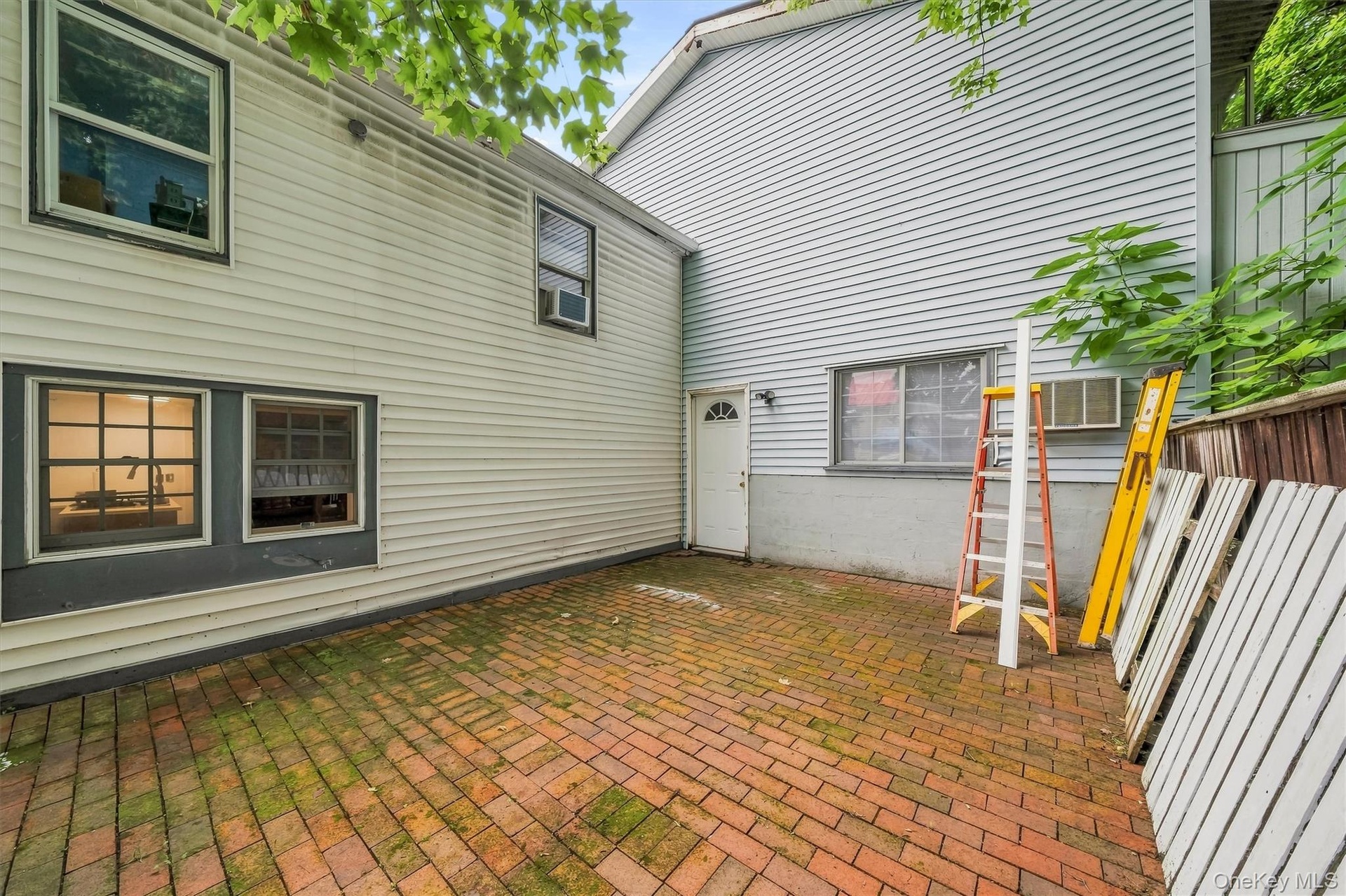 Another view of the brick patio and rear exterior.