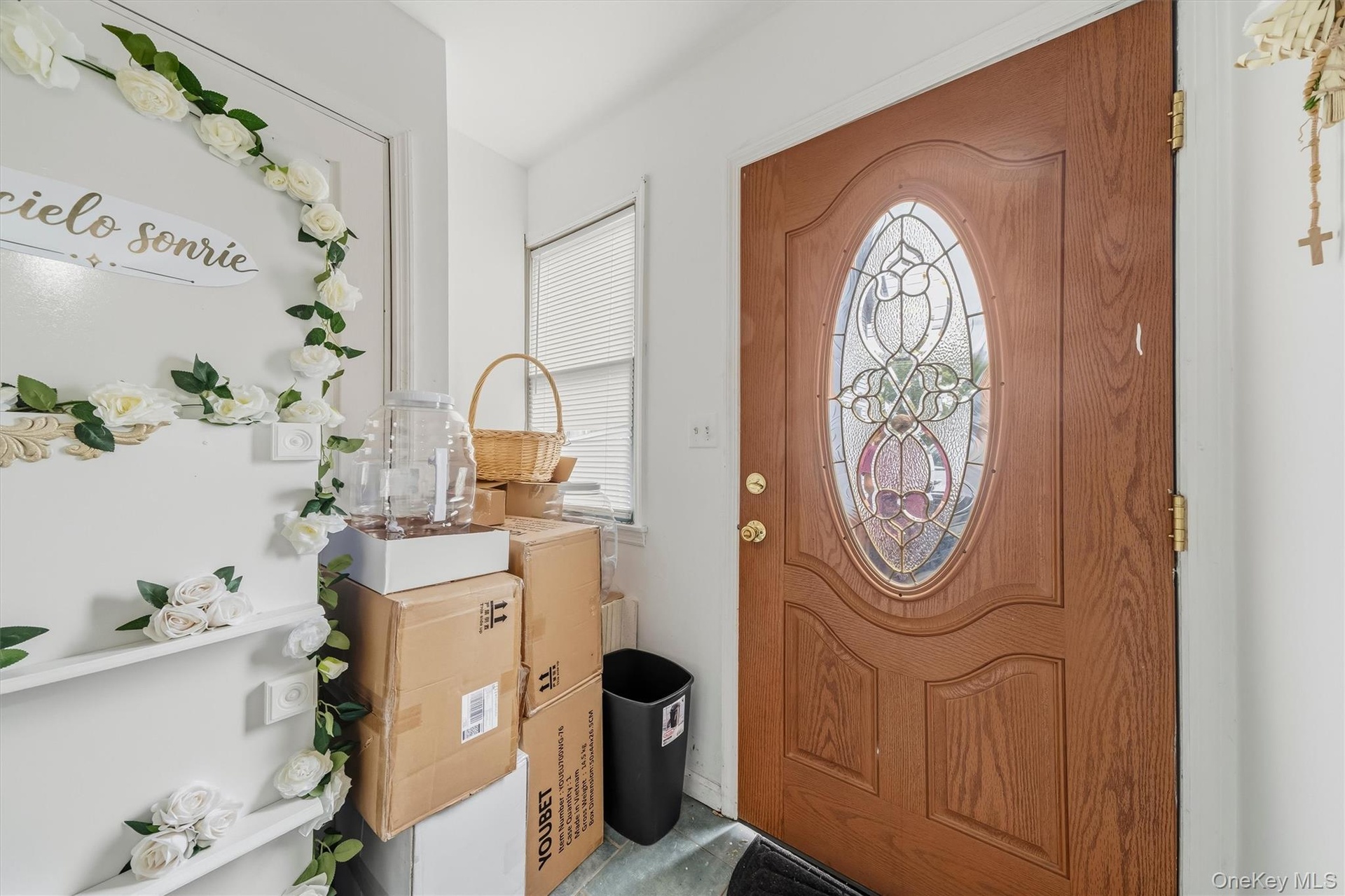 APARTMENT - Interior apartment entrance with decorative glass door.