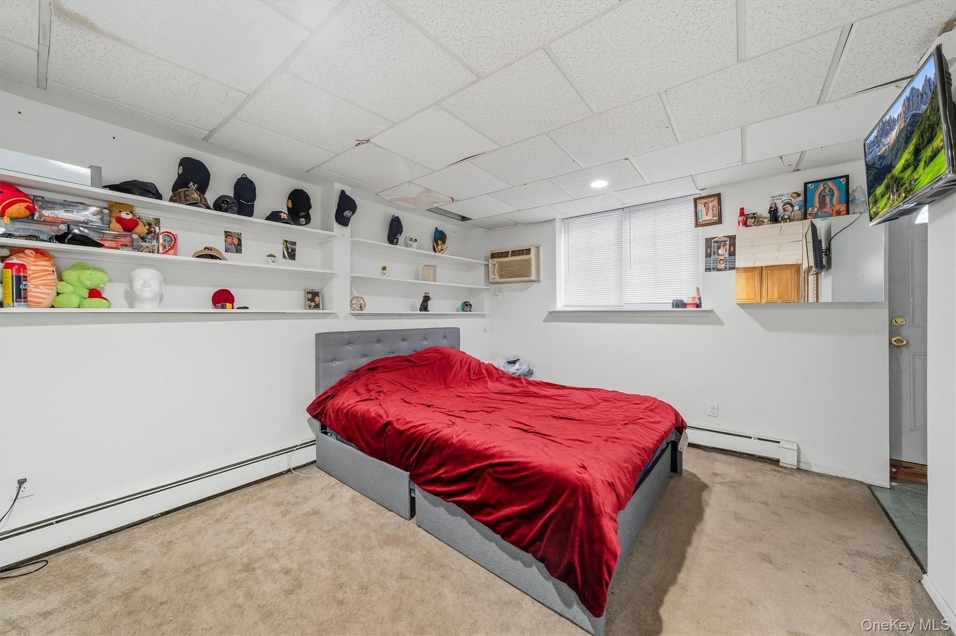 APARTMENT - Bedroom with built-in shelving and storage.