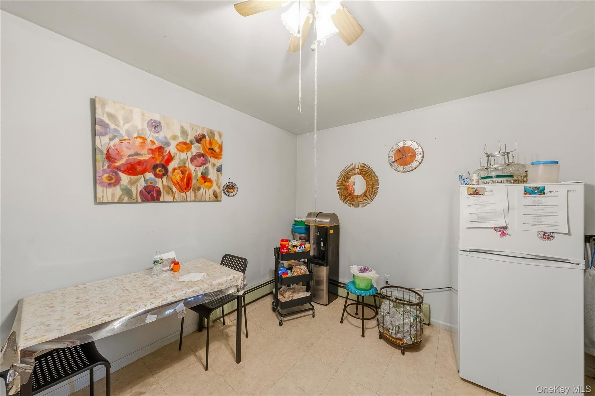 APARTMENT - Another kitchen angle showing the dining area and appliance space.