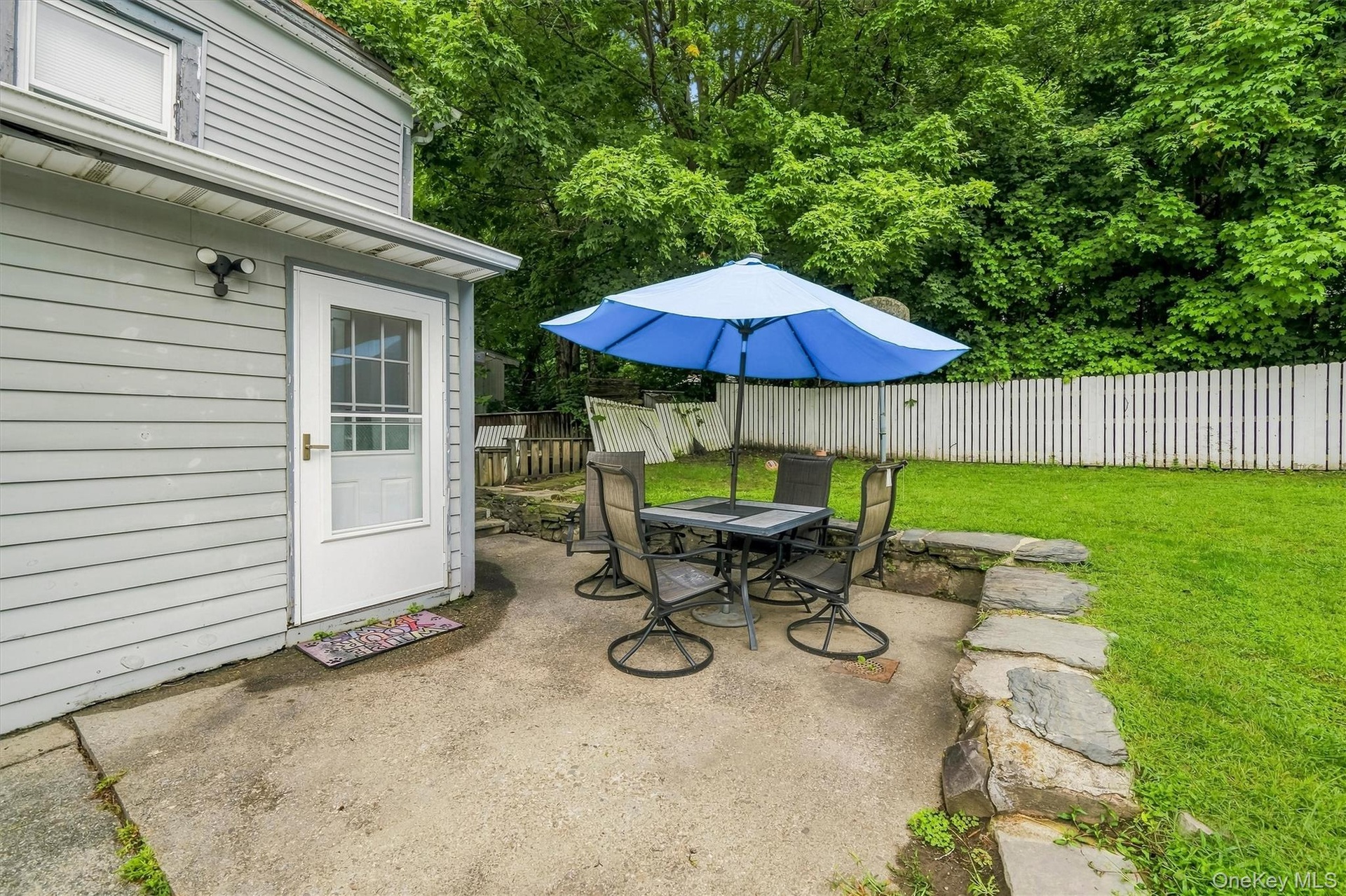 Additional patio area with direct access to the home and yard.