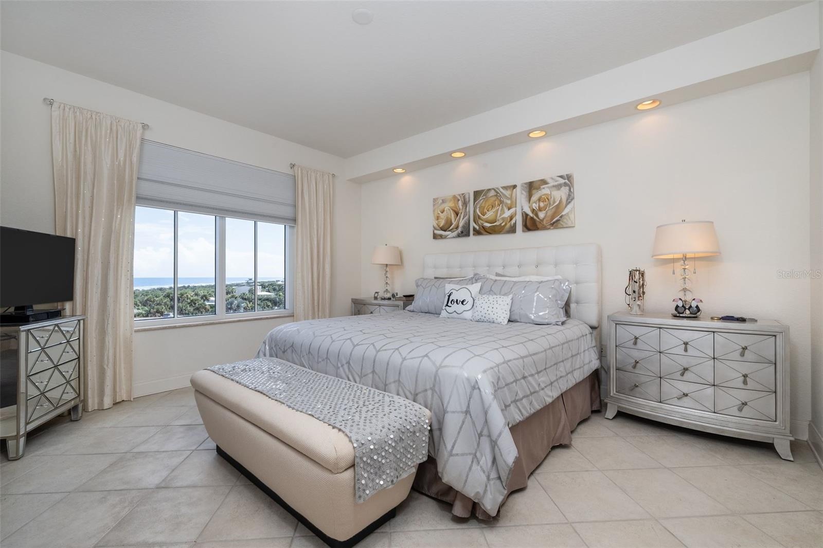 MBR features great views of the coastline & opens to balcony!