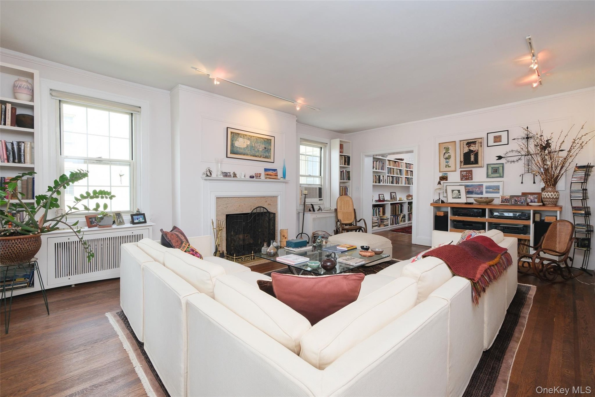 Apt. #4-B - Another view of Living Room looking north toward WBFP and east to Entry Foyer.