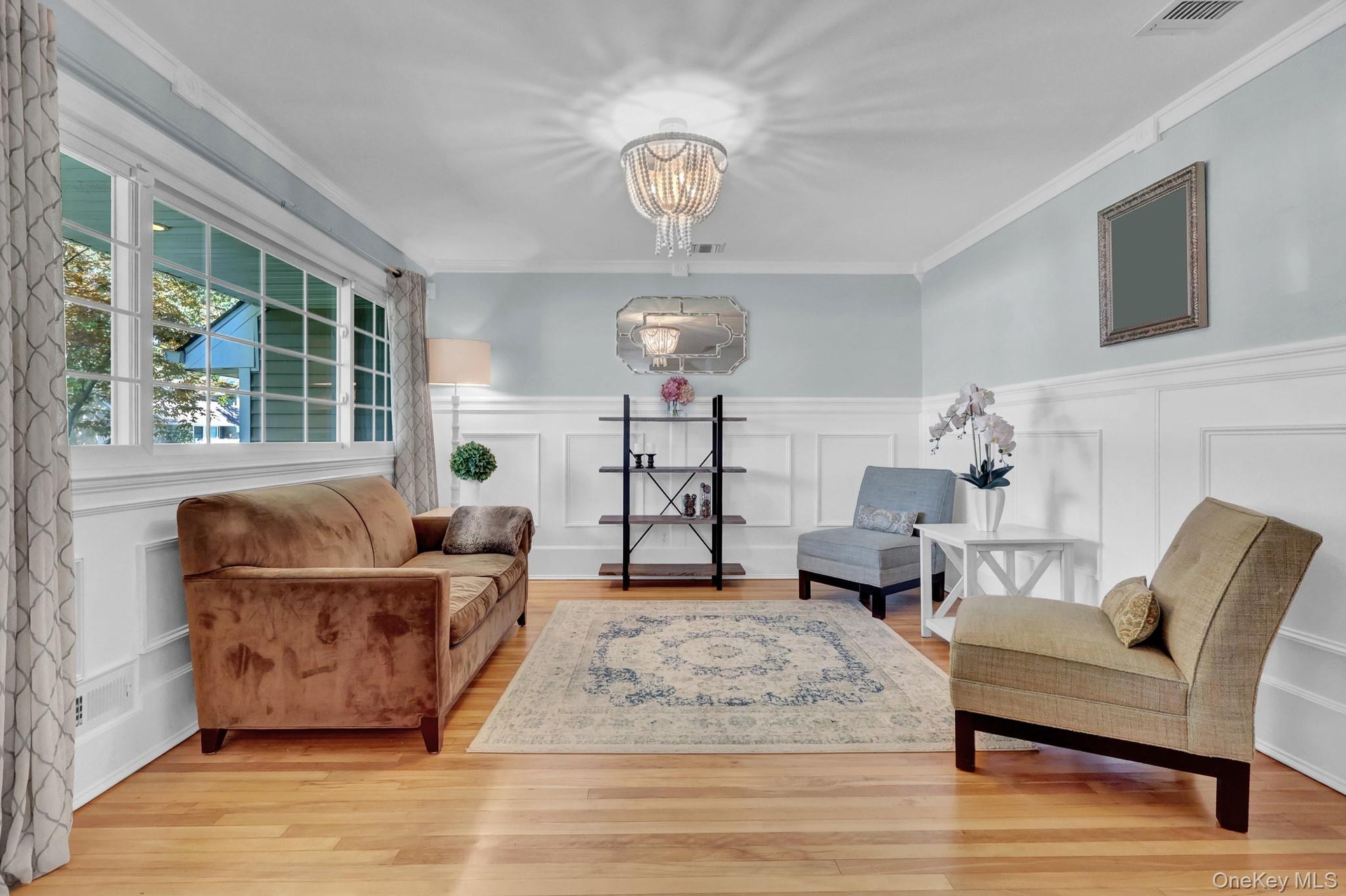 Hardwood floors, wall millwork. Bright and airy, open concept.