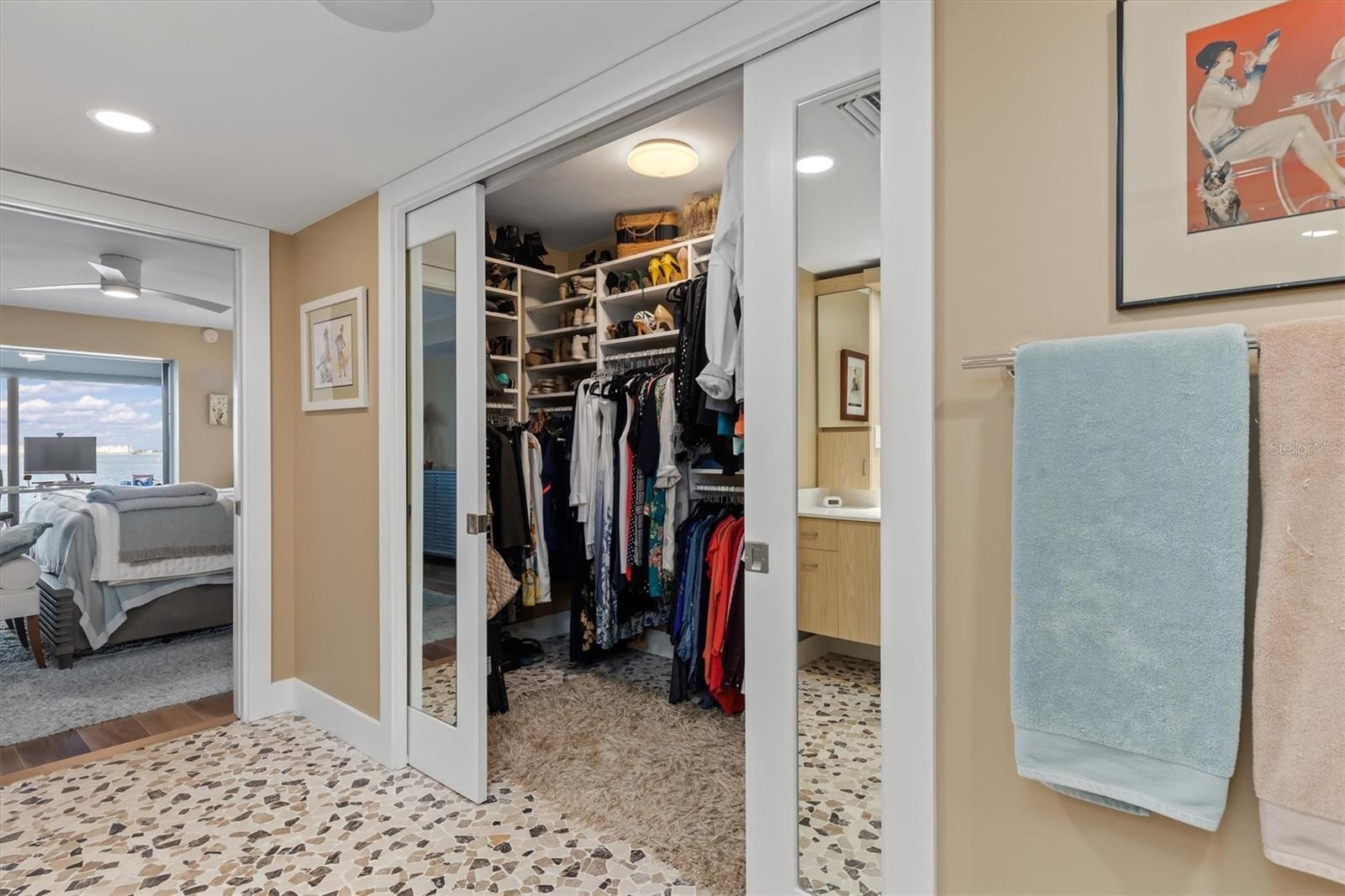 Sliding, mirrored pocket doors to walk in closet