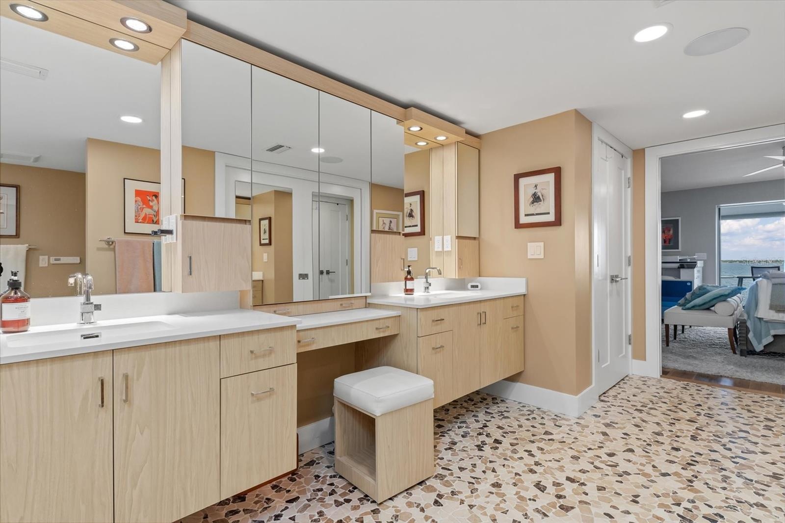 Walk in closet across from vanities