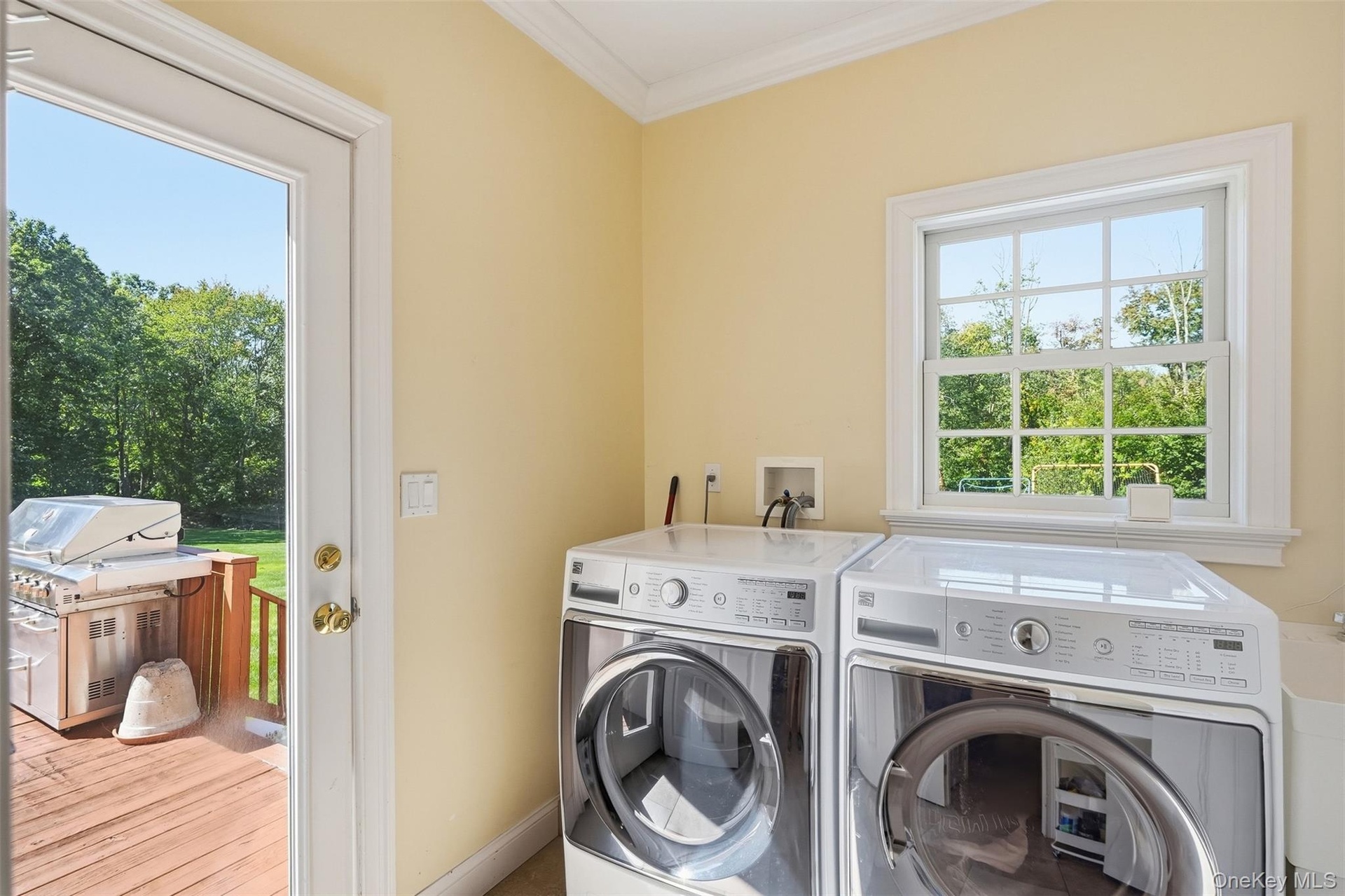 Laundry room with deck and garage access