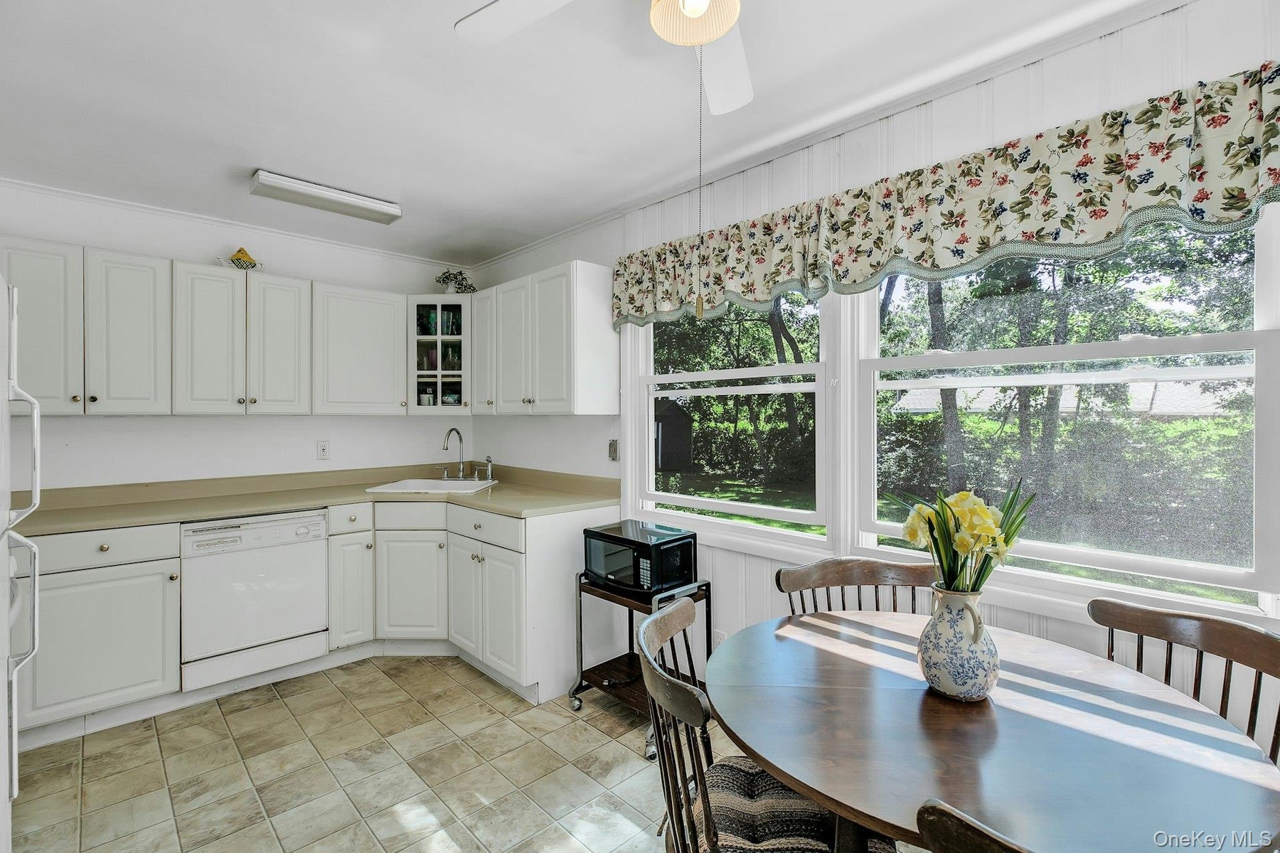 White cabinetry with brushed nickel hardware