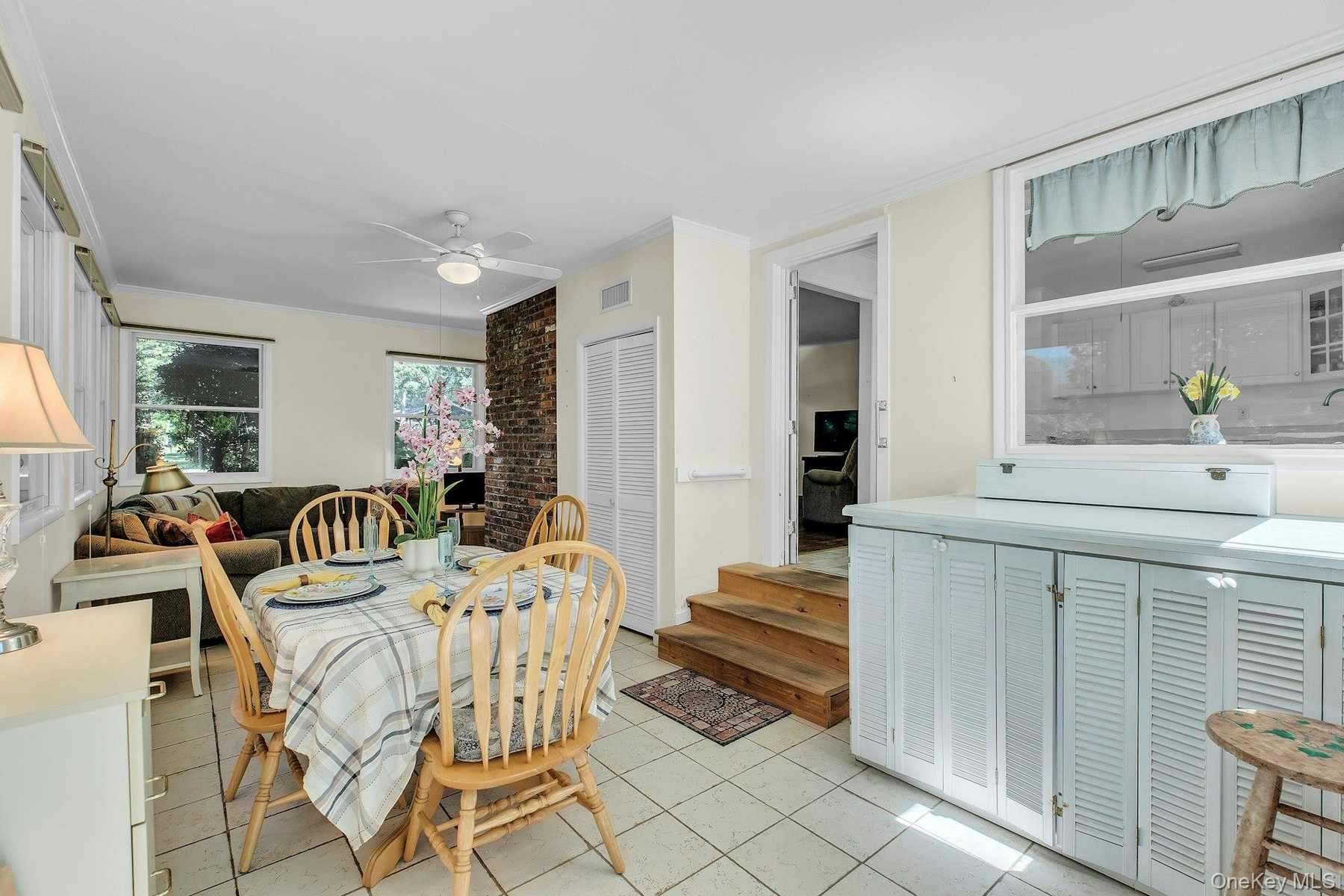 Tile flooring throughout, recessed lighting, ceiling fan, and painted walls