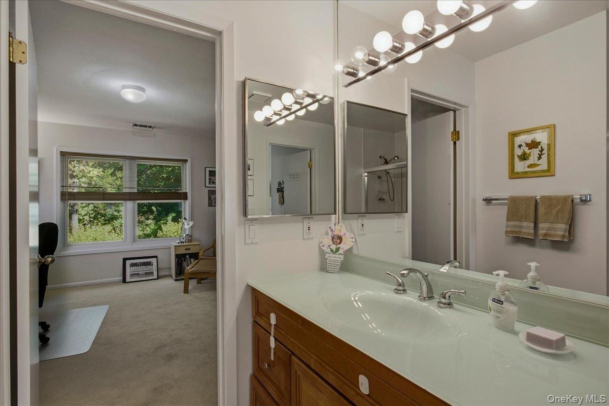 Bathroom with tub-and-shower combination.