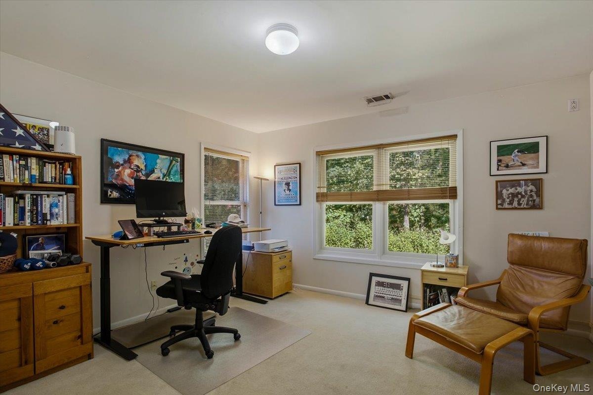 The third bedroom located on the second floor is currently used as a comfortable home office and includes new double hung windows and a large single c