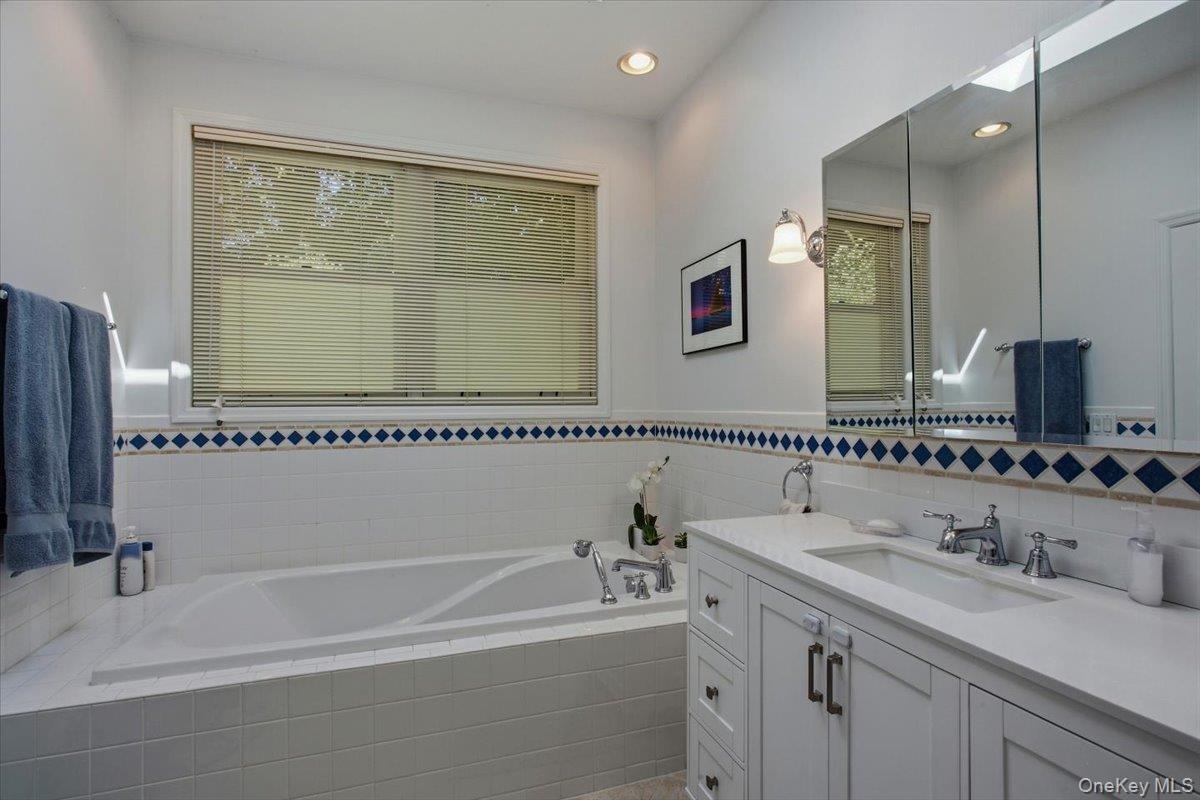 In addition, the primary bathroom offers a brand new tub offering comfortable and functional layout.