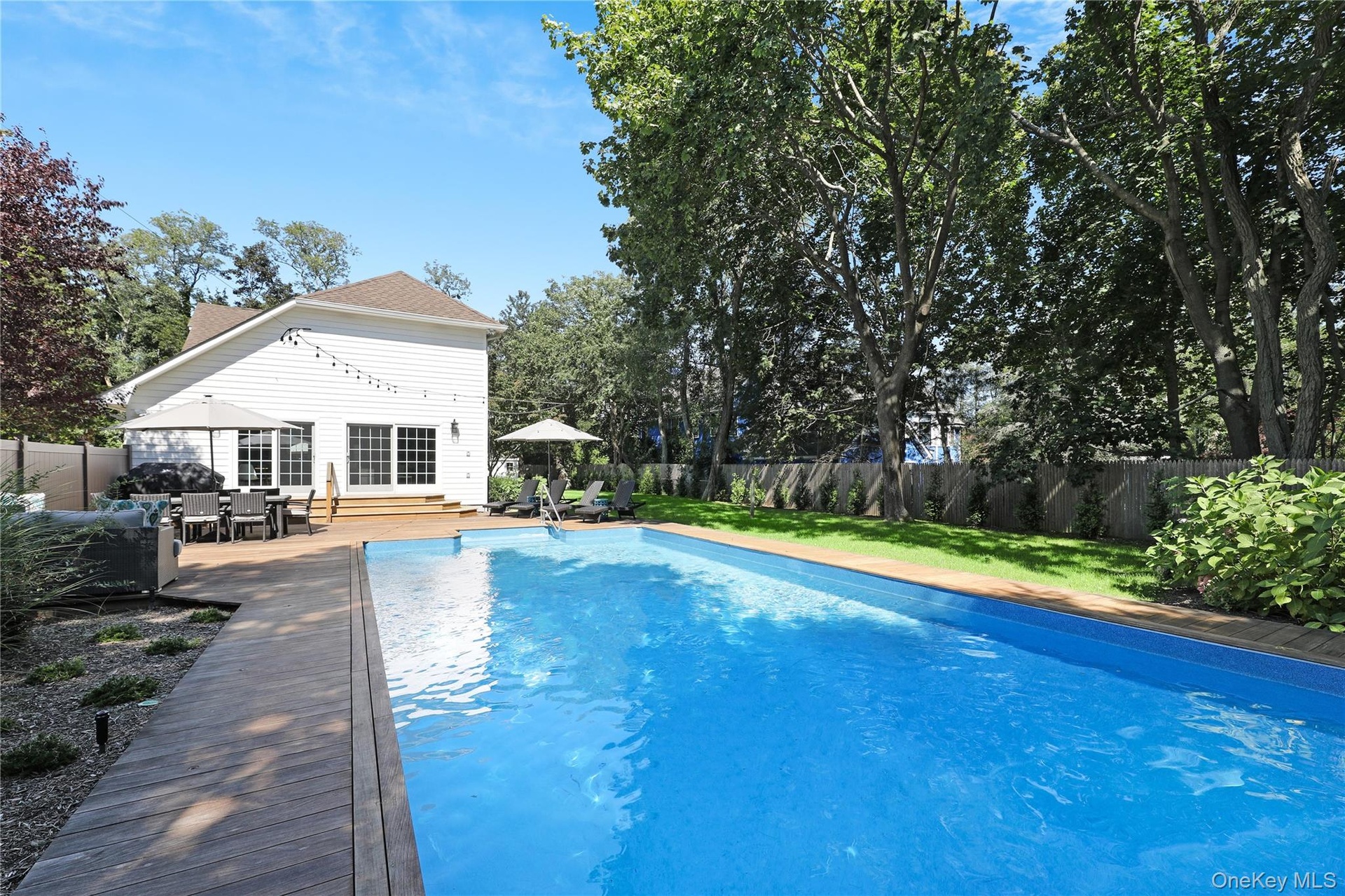 View of pool featuring a fenced backyard, a patio area, and outdoor dining area