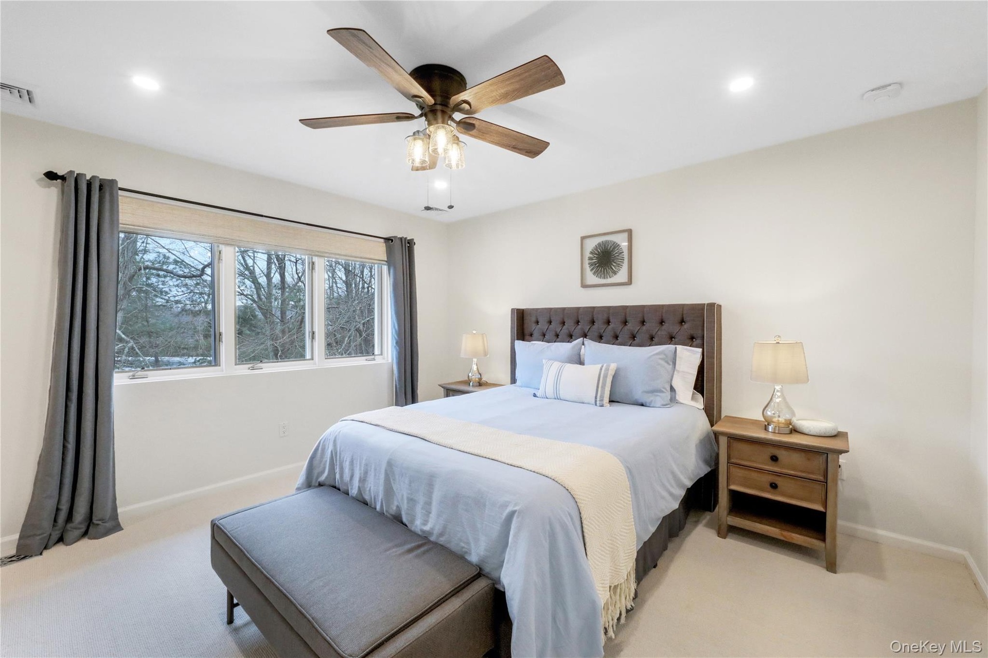 Bedroom featuring light colored carpet, recessed lighting, and a ceiling fan