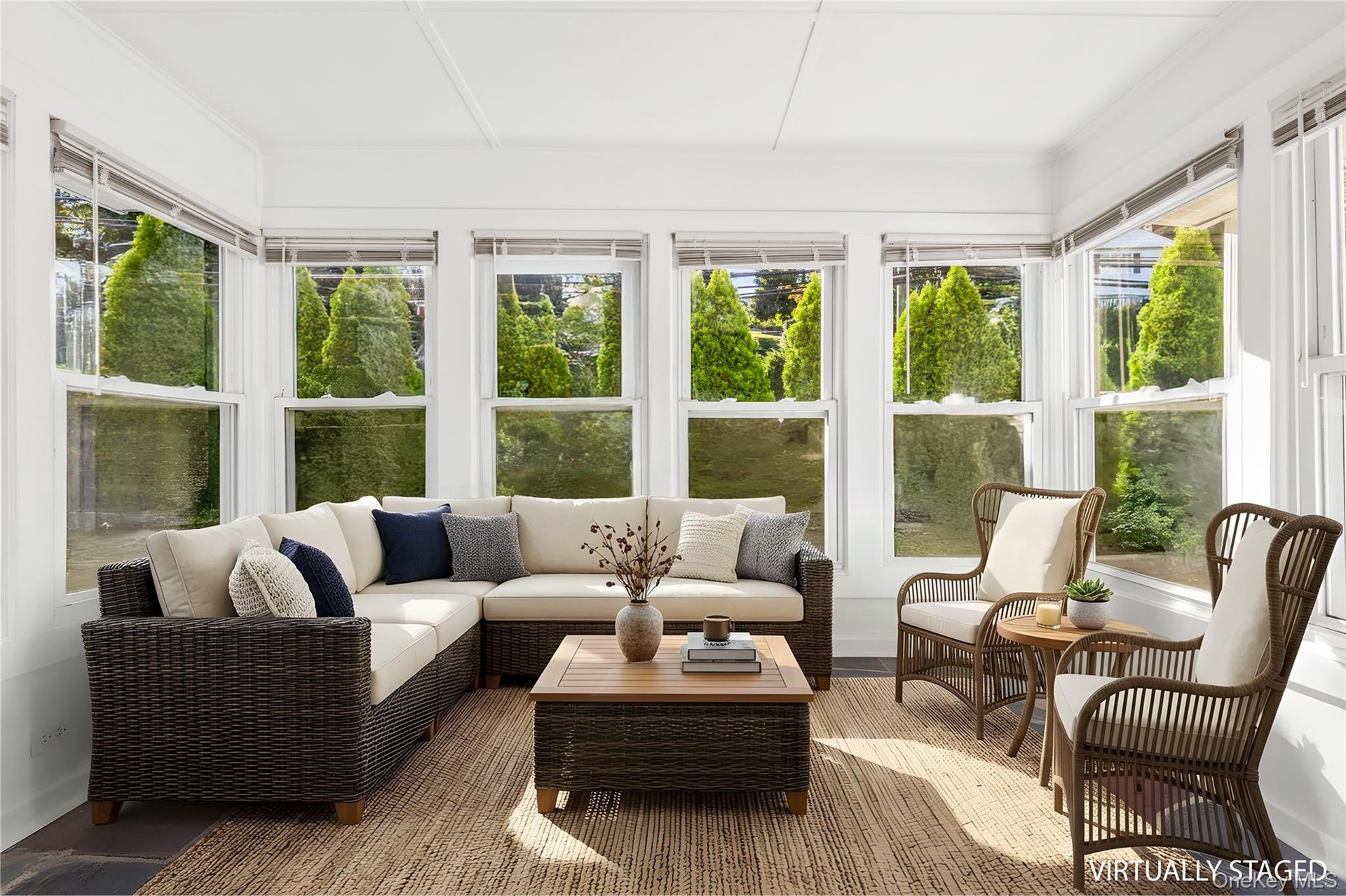 digitally furnished sun room off of first floor bedroom
